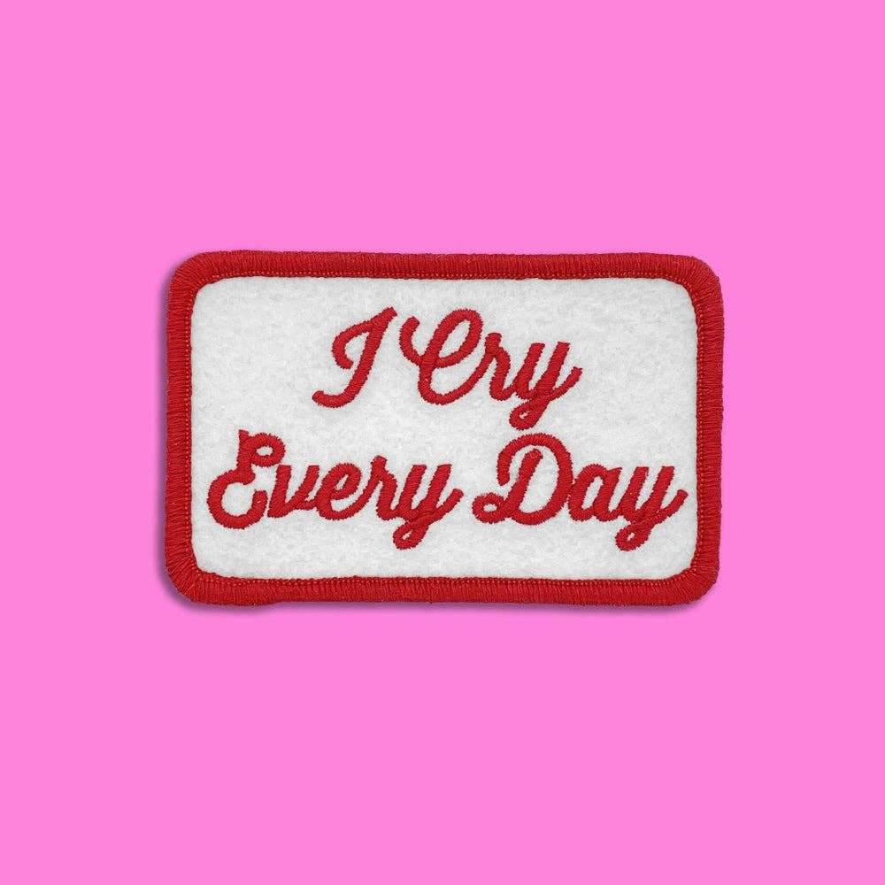 “I Cry Every Day” Embroidered Patch. White Felt Rectangle Patch With Red Embroidery. Patch Has Whip-Stitched Rounded Corners In Red