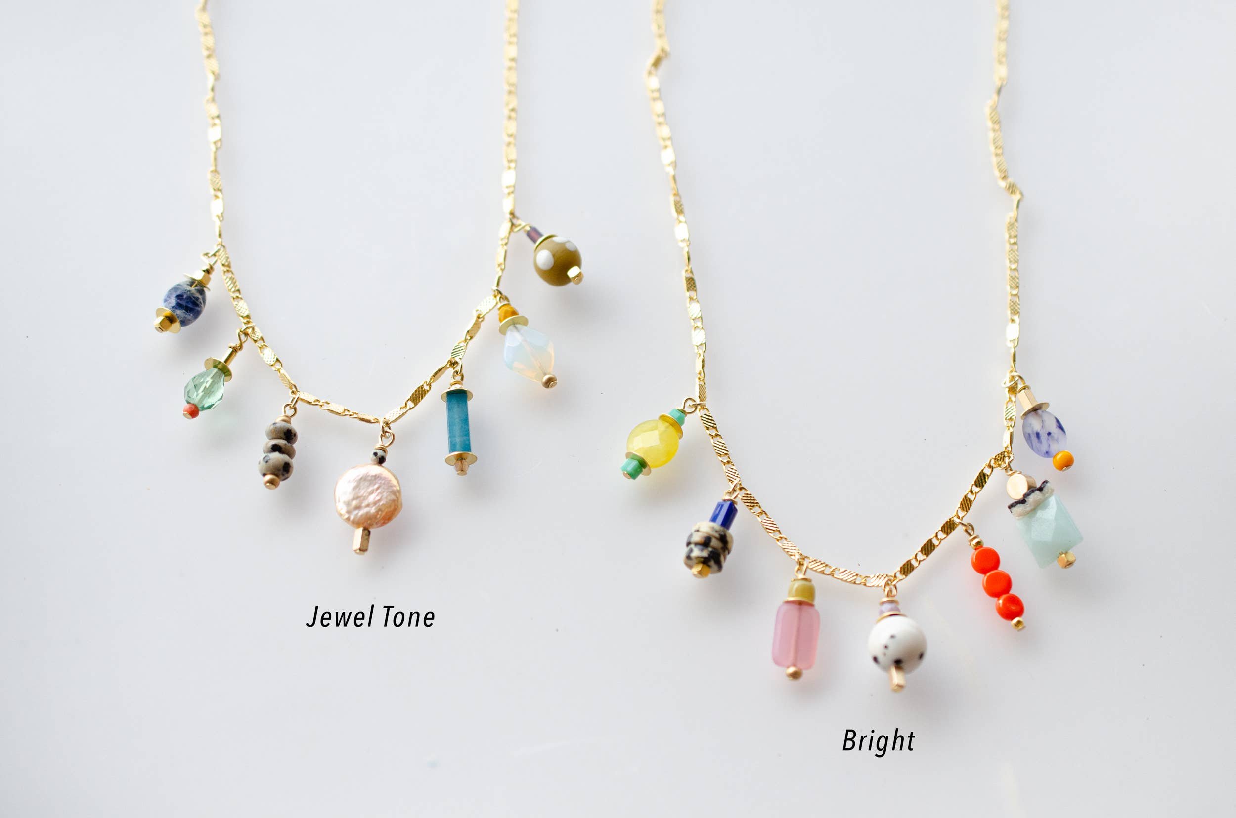 Image Of Two Minimalist Gold Necklaces With Colorful Glass Beads That Hang Down From The Main Chain Approx One Half Inch.