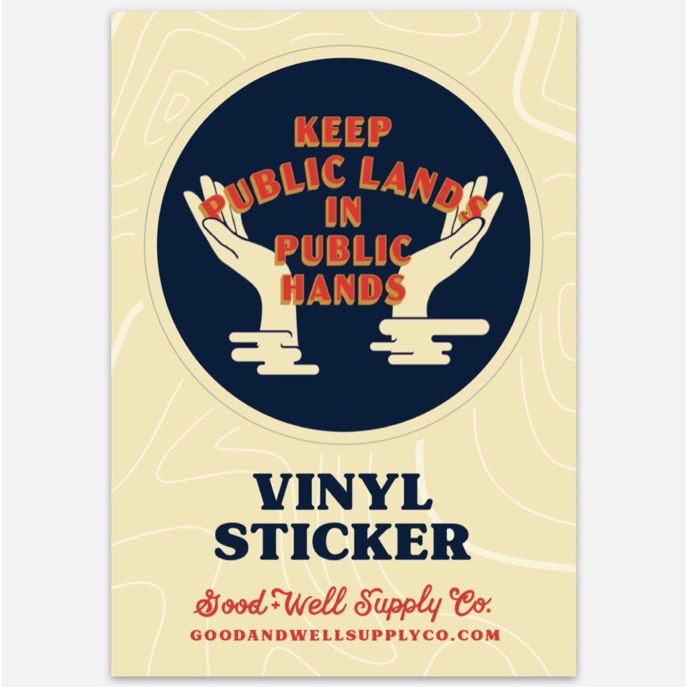 Image Of Keep Public Lands In Public Hands Vinyl Sticker. WPA-Era Inspired Design With Open Hands Flanking Block Vintage Type. Sticker Is Blue With Red.