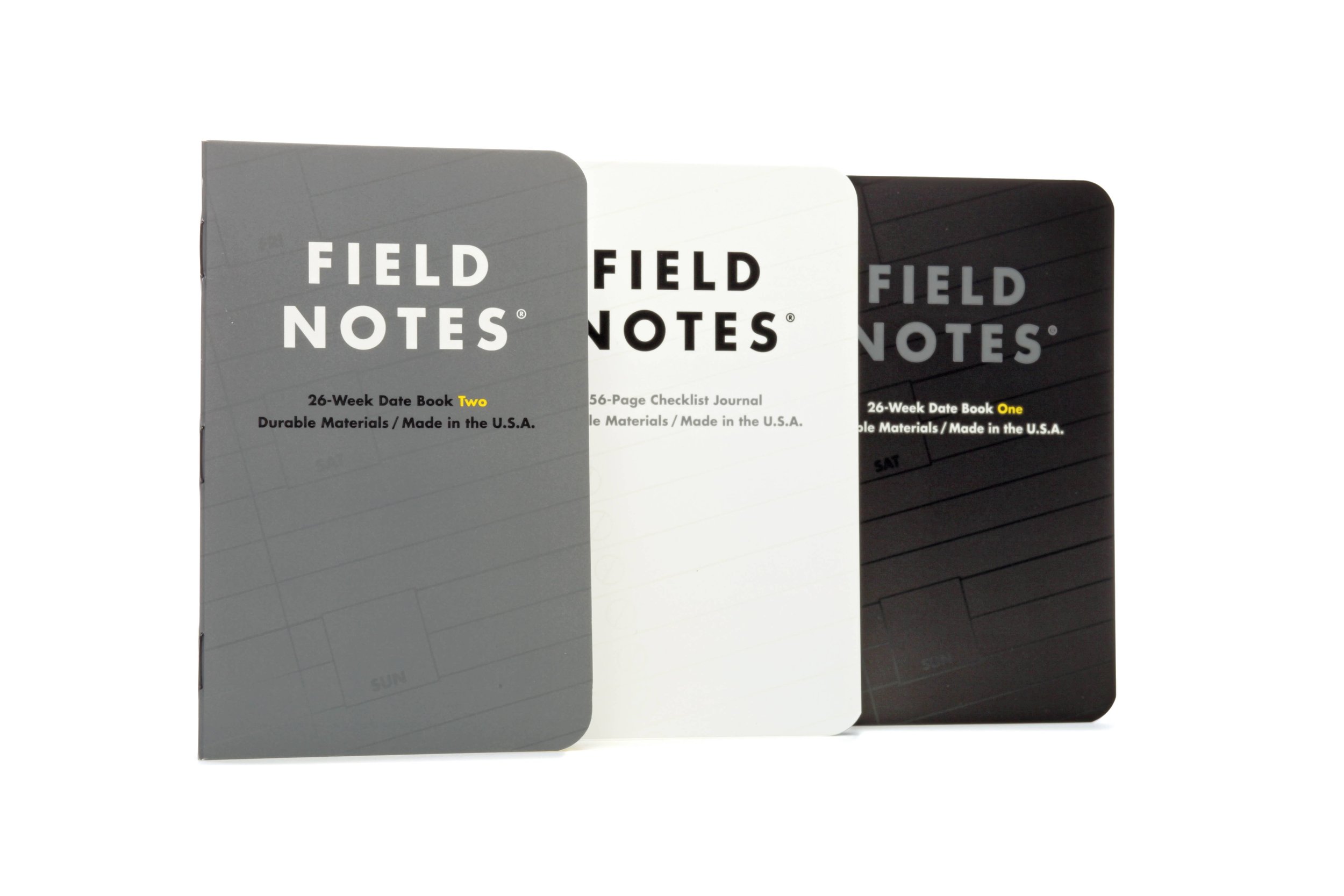 Image of Three Field Notes Brand “Ignition” Pocket Planner Notebooks In Grey, White And Black With Futura Letterpress Type Covers