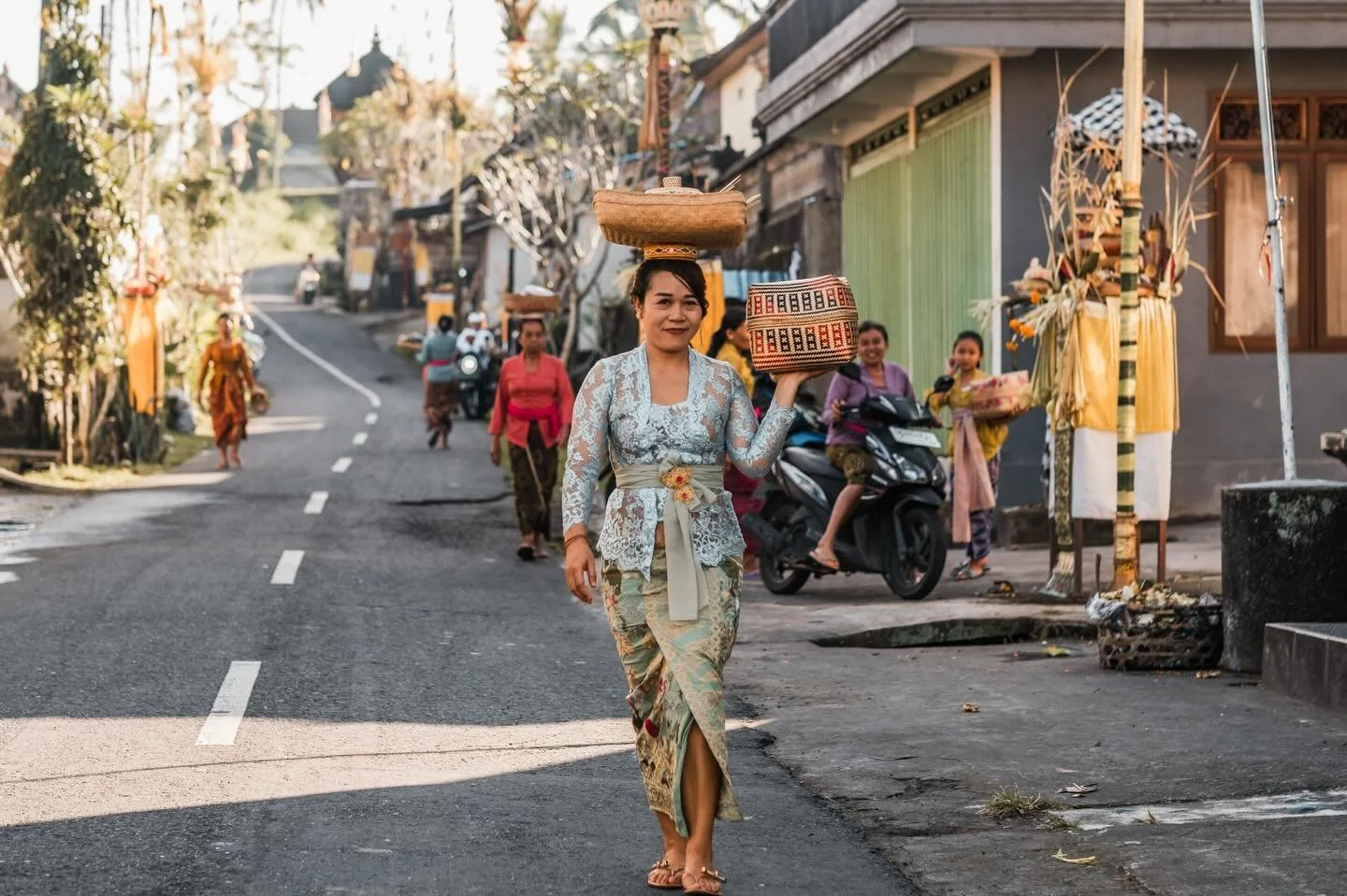 Balinese woman carrying offerings. Ubud, Bali. 2025