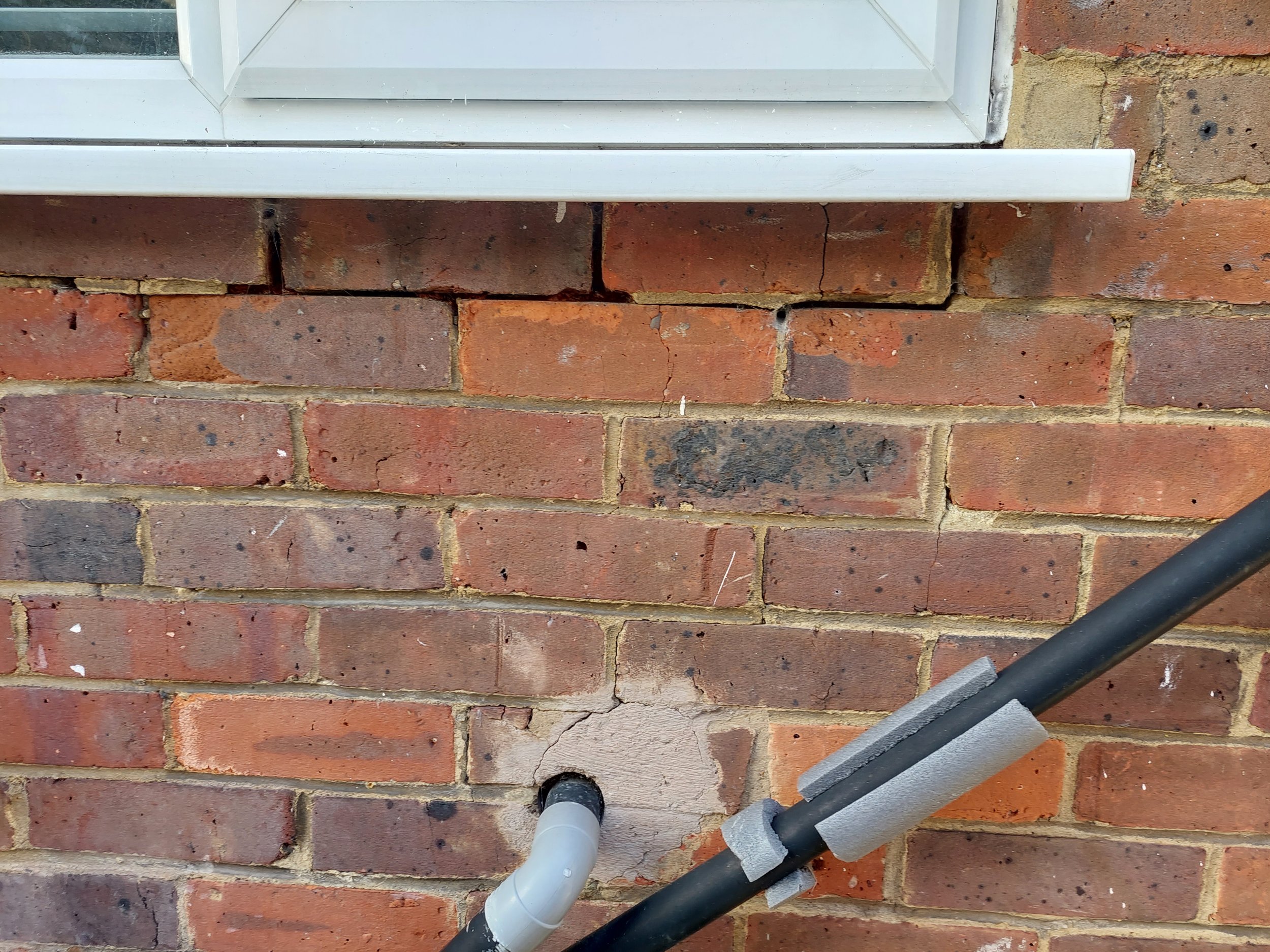 Receded mortar under window