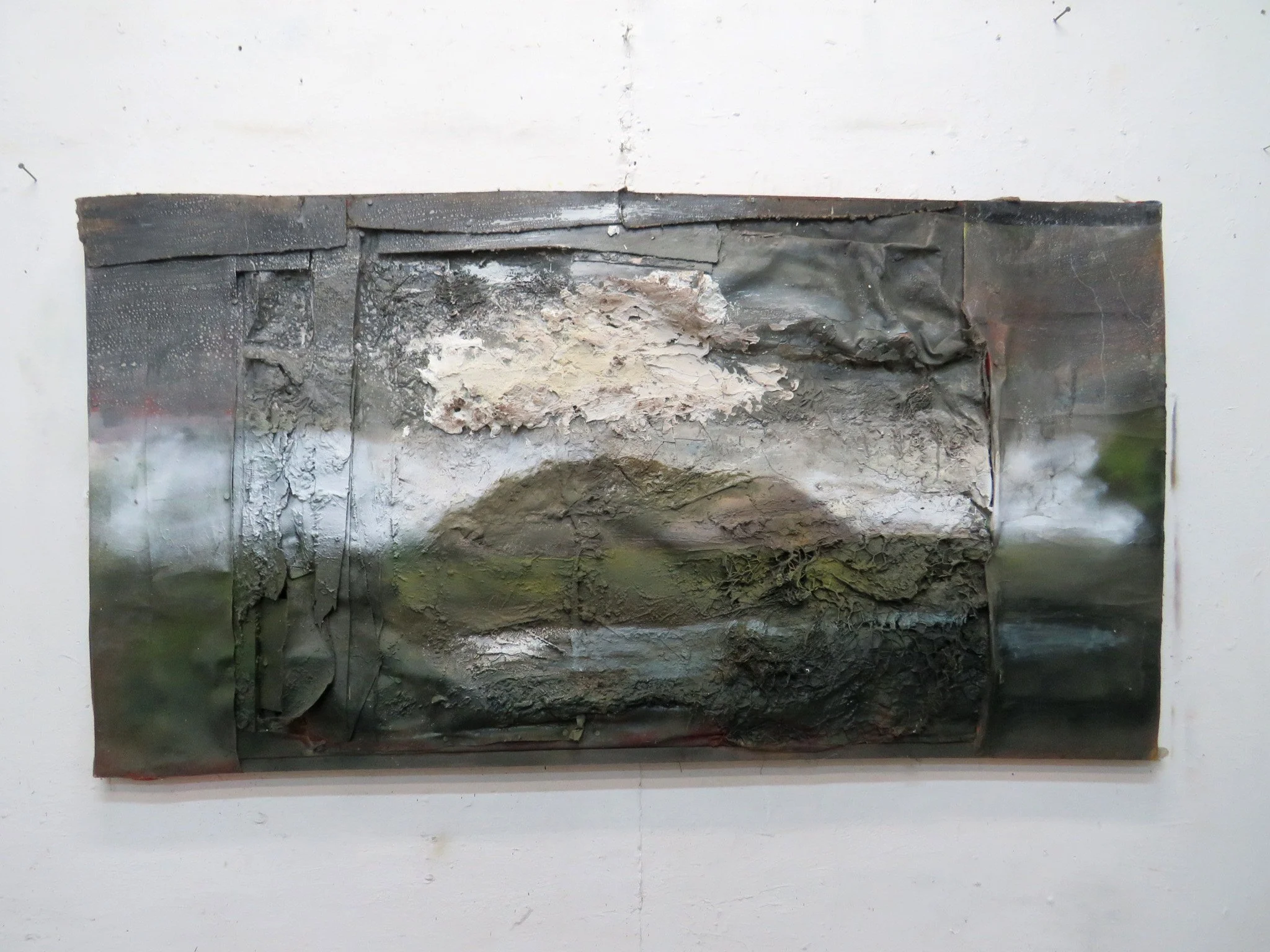 Pile of top soil, man made lagoon and single cloud 97 x 182 cms