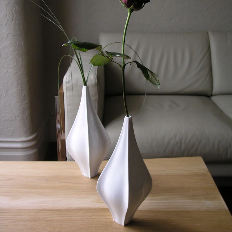 Finn Vase - Two white, glazed English bone china/ ceramic Finn Vase on table with single rose inside