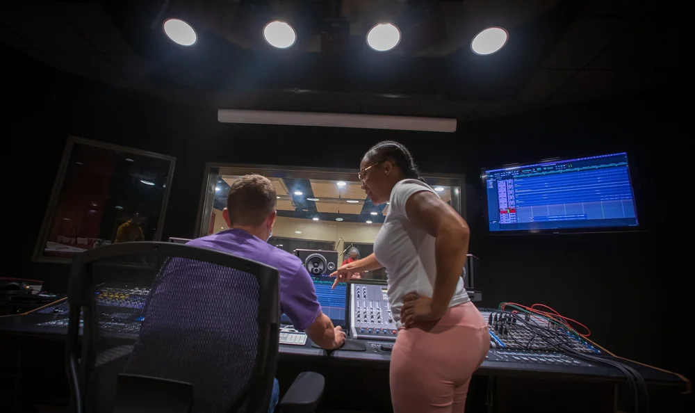 A student recording in the studio