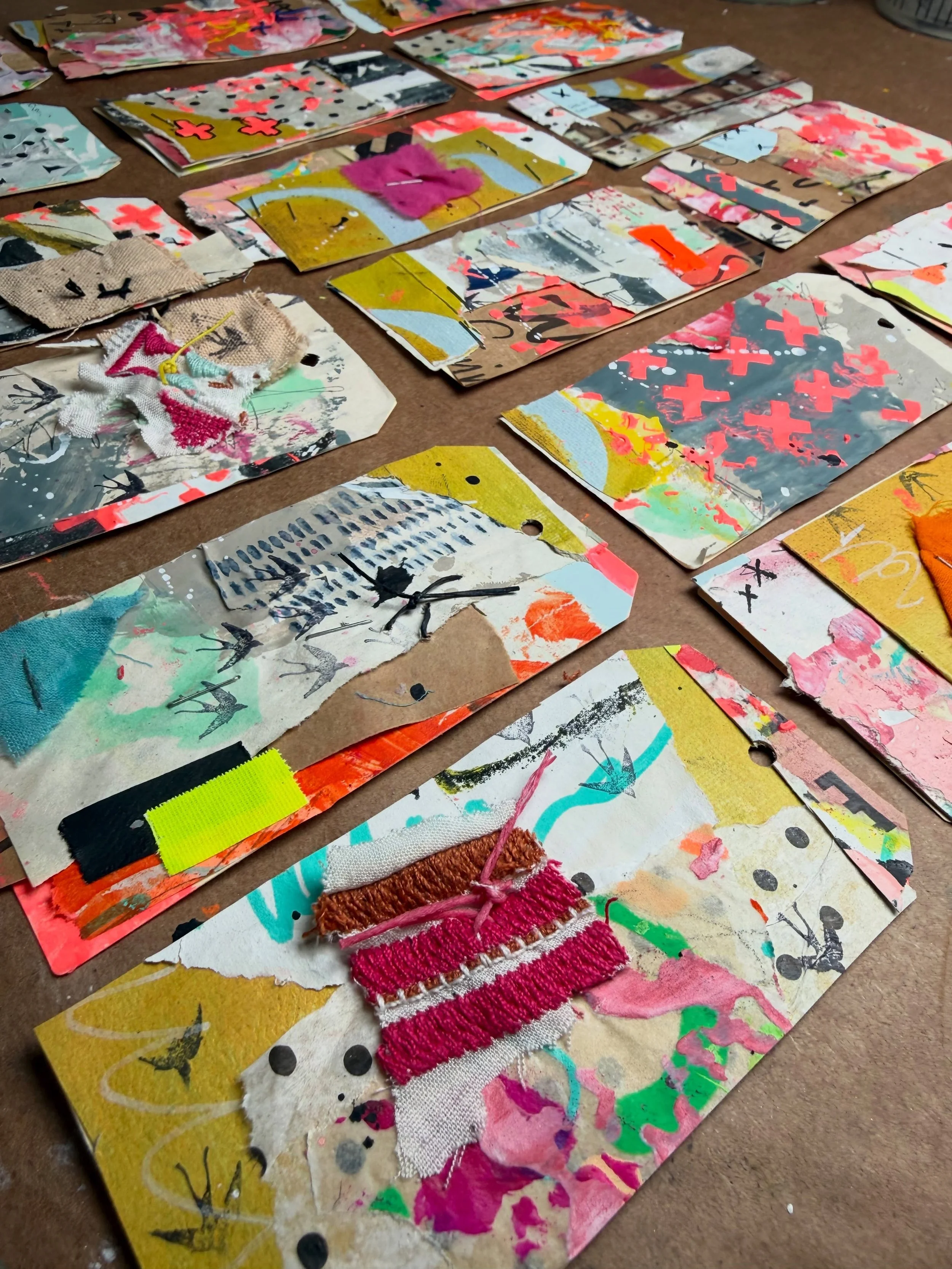 From a long snippet roll into very artsy gift tags; this project was so fun and loose! It was a great way to use up small bits, too. Very similar to my Tiny Urban Collages. 
You can see them tucked into some little gift bundles that my retreat guests