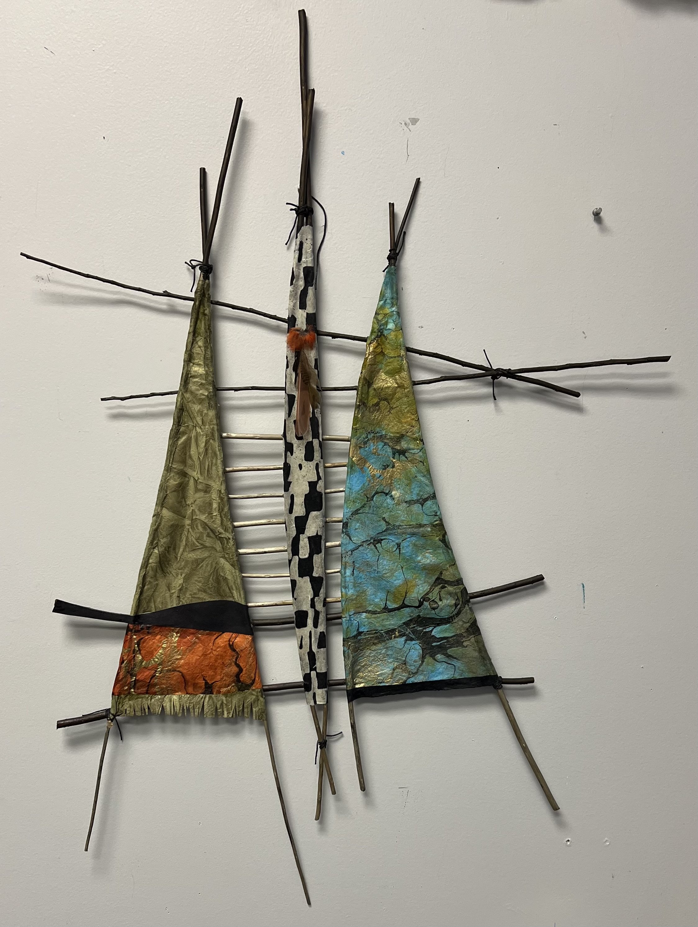Camping in Two Tents, Sticks and paper, there is a collection of bird feathers I find as a sort of totem representing the camp members,
"UPDATE, this has sold but will make you one that will be uniquely yours.  11/2024"