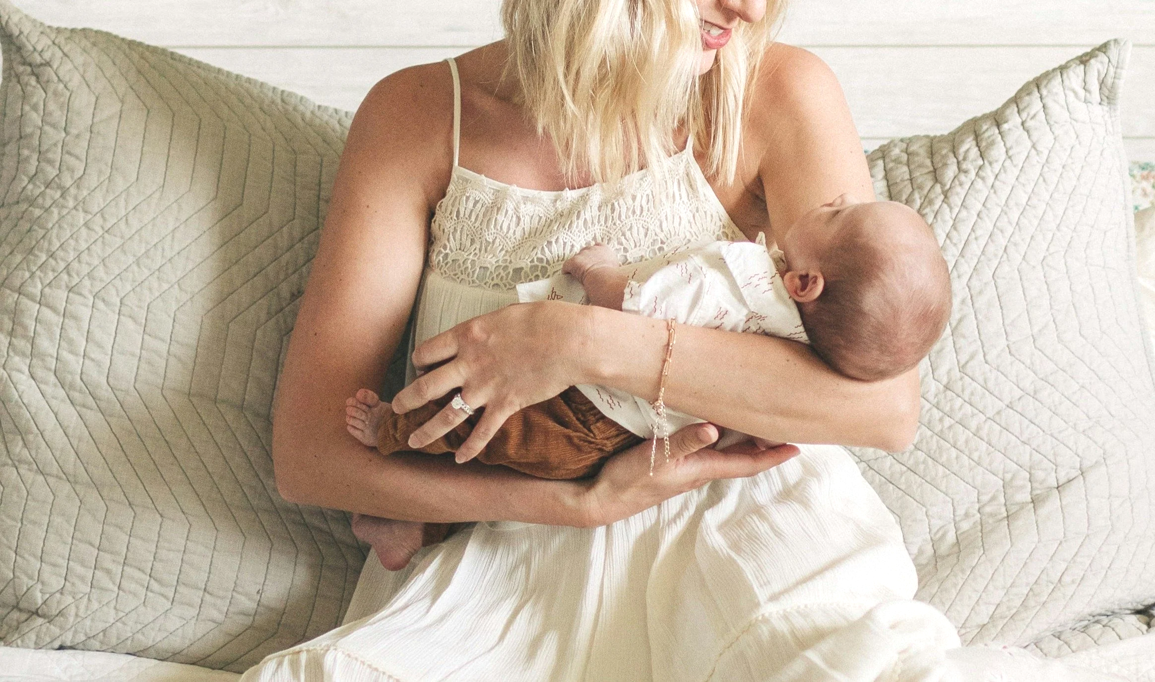 mom and baby white bed cropped.png