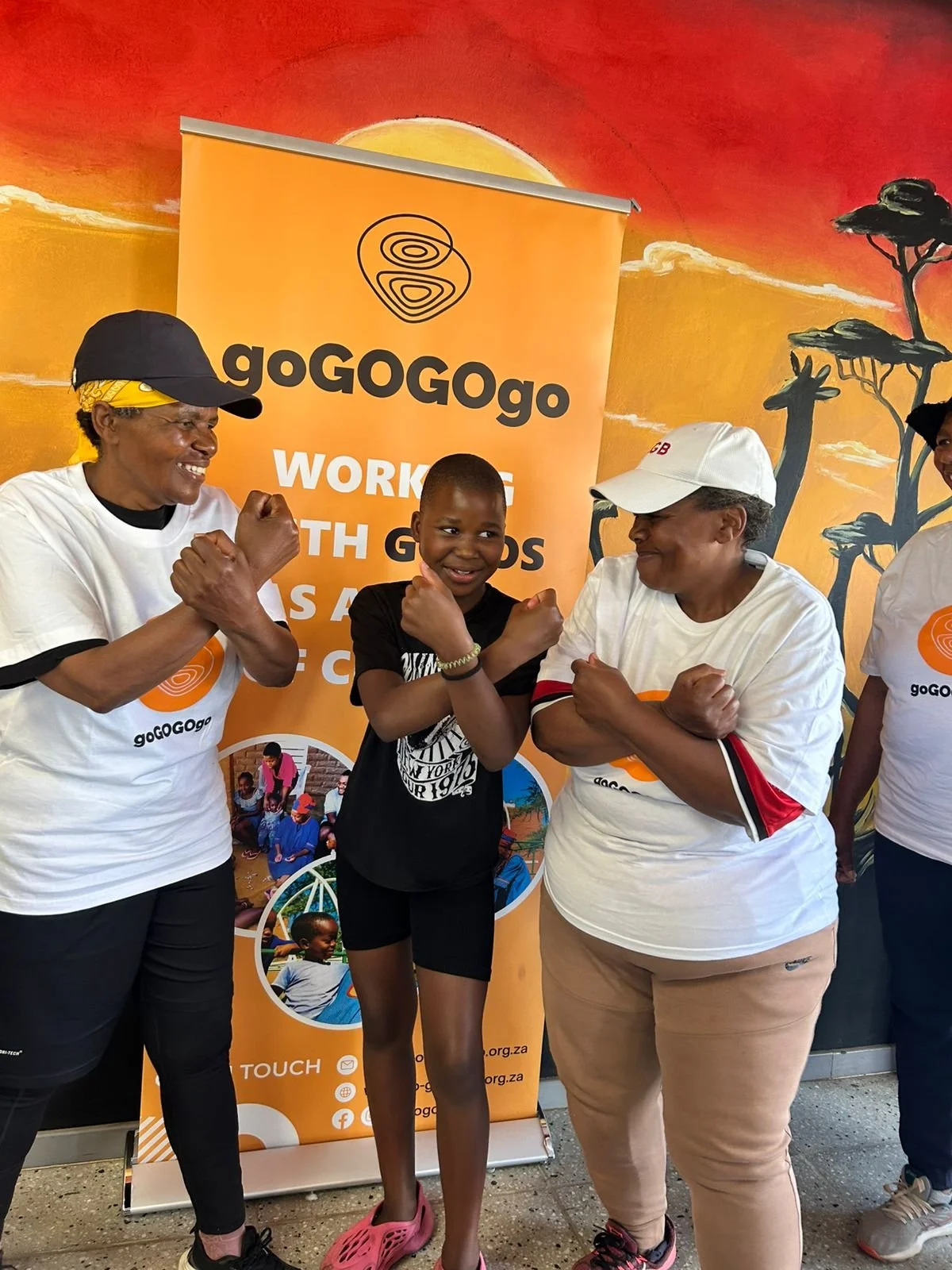 gogos and grandchild pose at masidlale