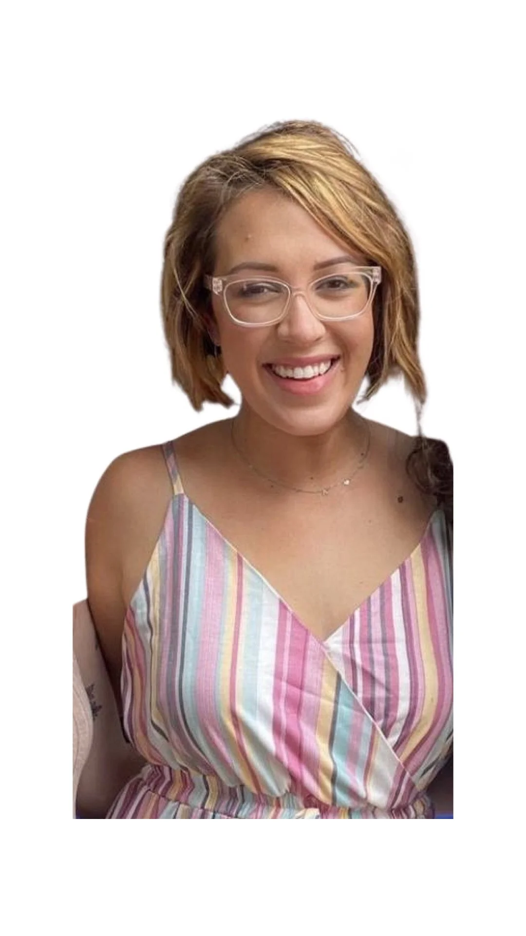 A young woman with short, wavy, light brown hair and glasses smiling, wearing a colorful striped sleeveless top.