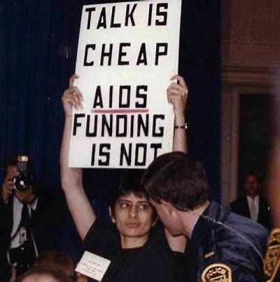 #WomensHistoryMonth Urvashi Vaid was an extraordinary and influential queer and AIDS activist for decades, whose leadership and legacy continue to inspire. This image, taken #OnThisDate March 29, 1990, shows Urvashi interrupting former President Geor
