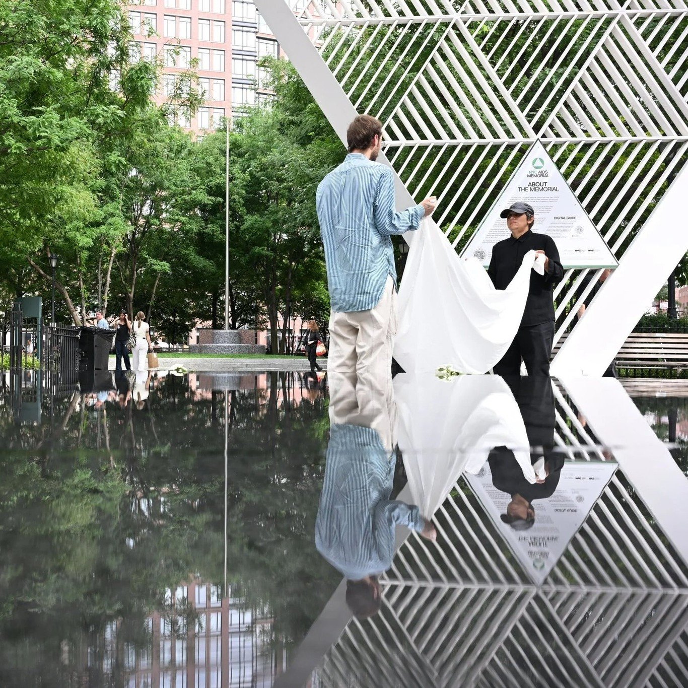 On July 10, as part of West Side Fest (@westsidefestnyc), artist Maria De Victoria stood from dawn to dusk at the #NYCAIDSMemorial for her site-specific performance, HELP ME HOLD THIS. 

Holding a single white sheet, evoking St. Vincent&rsquo;s Hospi