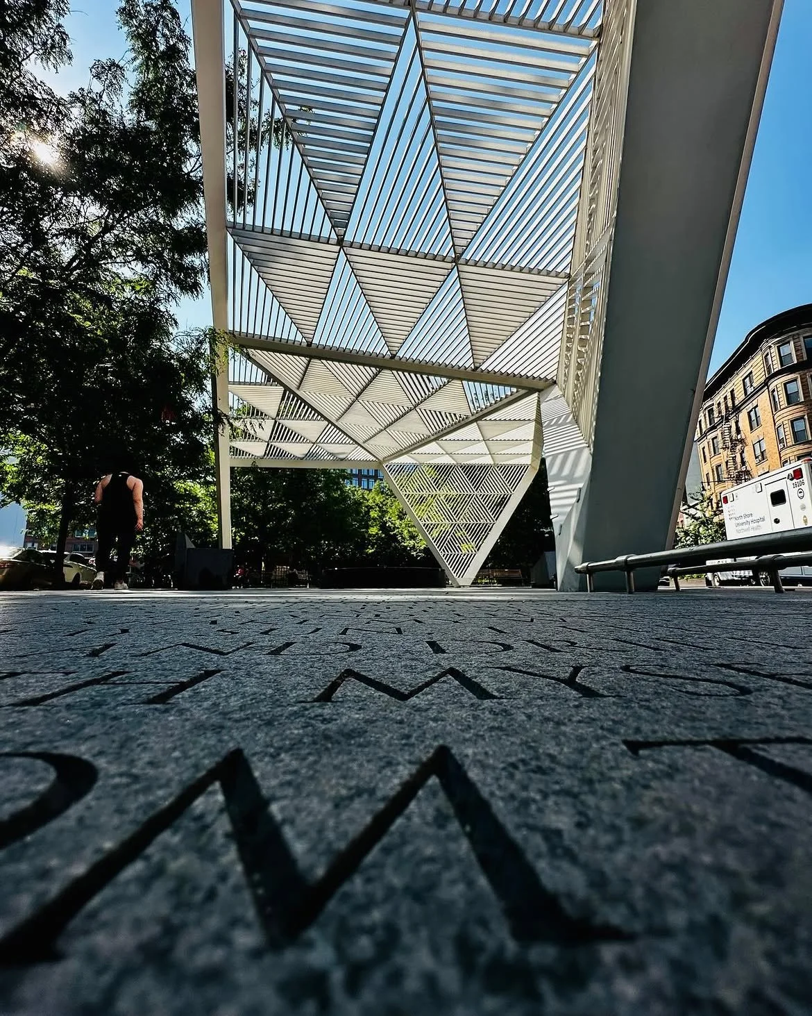 Word underfoot; forms overhead. #NYCAIDSMemorial is a place to remember and reflect as well as empower current and future activists, health professionals, and people living with HIV in the continuing mission to eradicate the disease. 📸 @orenyonayov