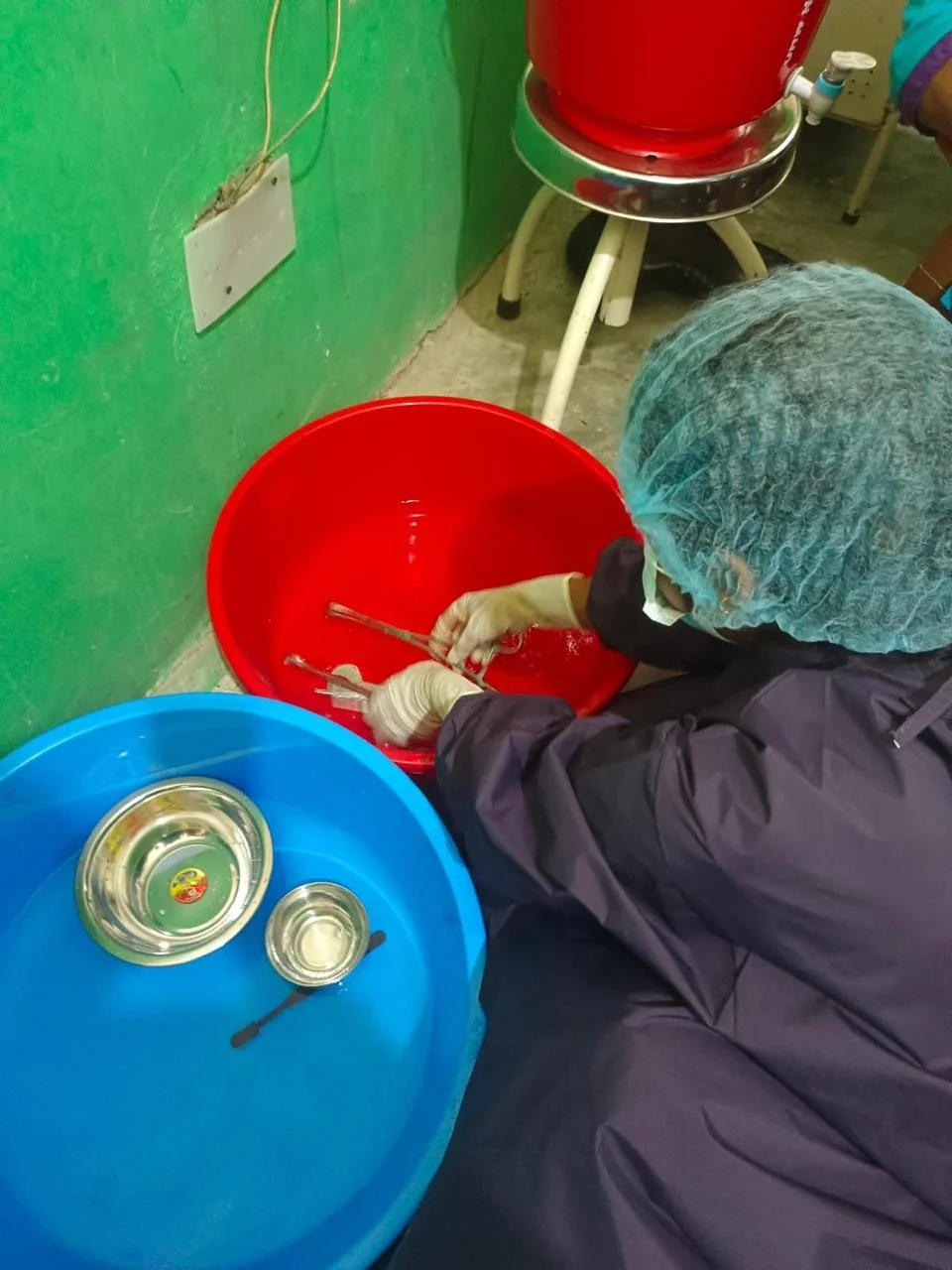 Mentee performing cleaning of instruments.jpg