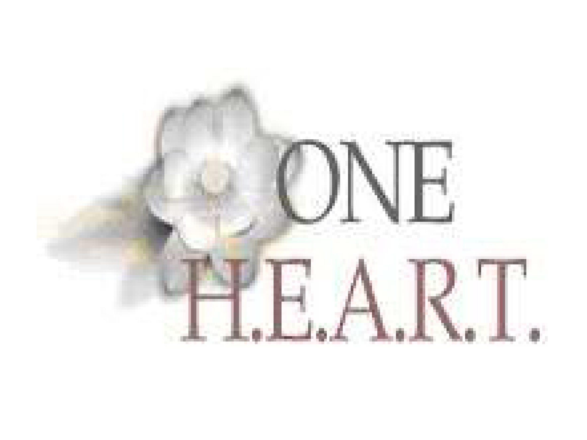One Heart Worldwide's first logo; a white flower with the text ONE H.E.A.R.T.