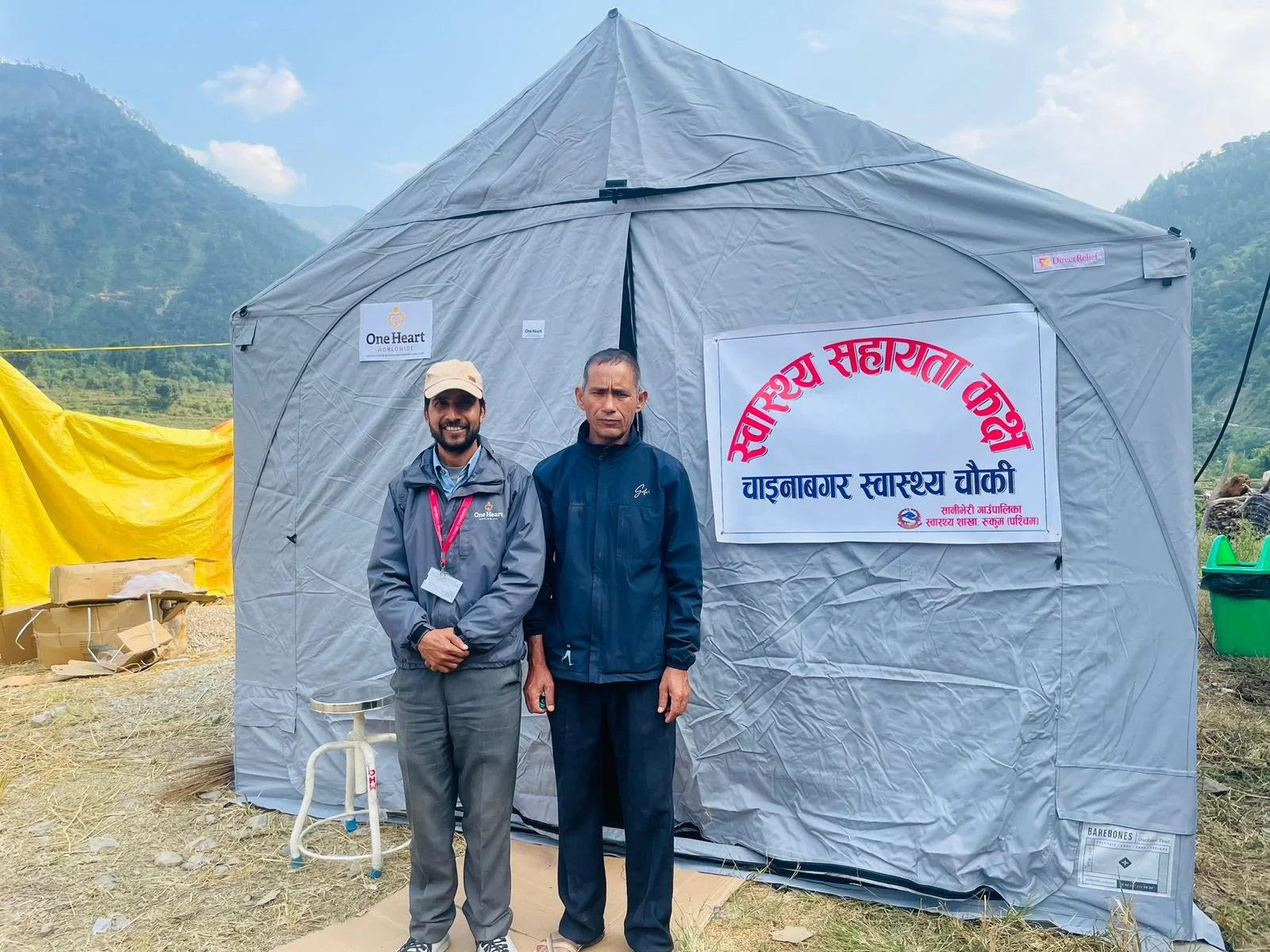 OHW staff member with a local stakeholder in Jajarkot District after the successful set-up of an emergency birthing tent that will serve as a health facility in the aftermath of a 5.7 magnitude earthquake.