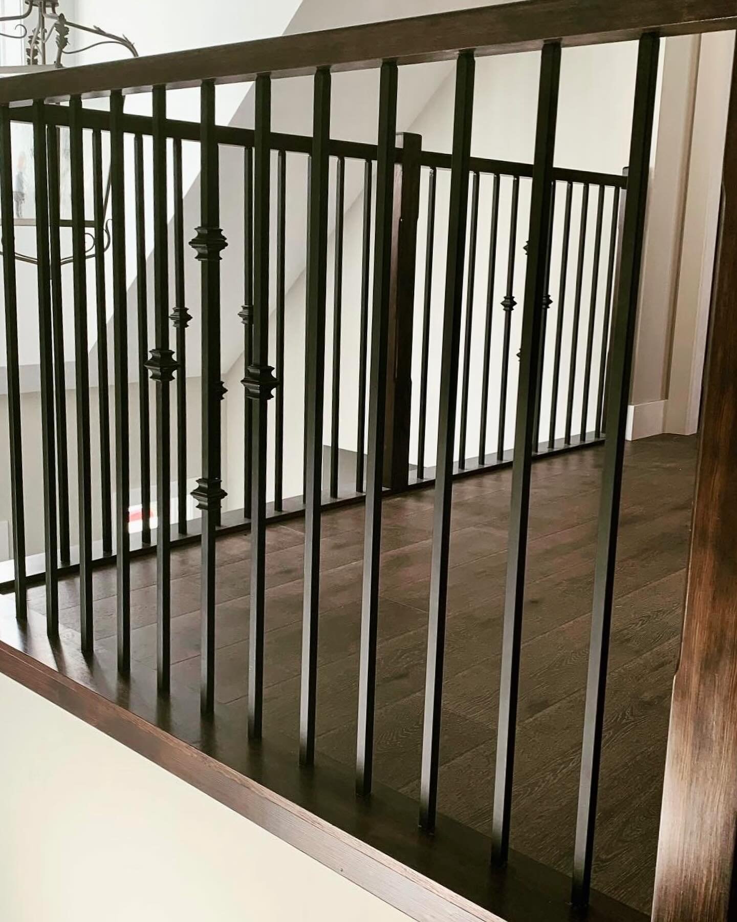 Simplicity and sophistication in this handrail. Dark stained oak and black iron spindles come together for a timeless touch. #yyj #victoriabccanada #victoriarealestate #yyjbusiness #kitchendesign #bathroomdesign #interiordesign #hightideinteriors #yy