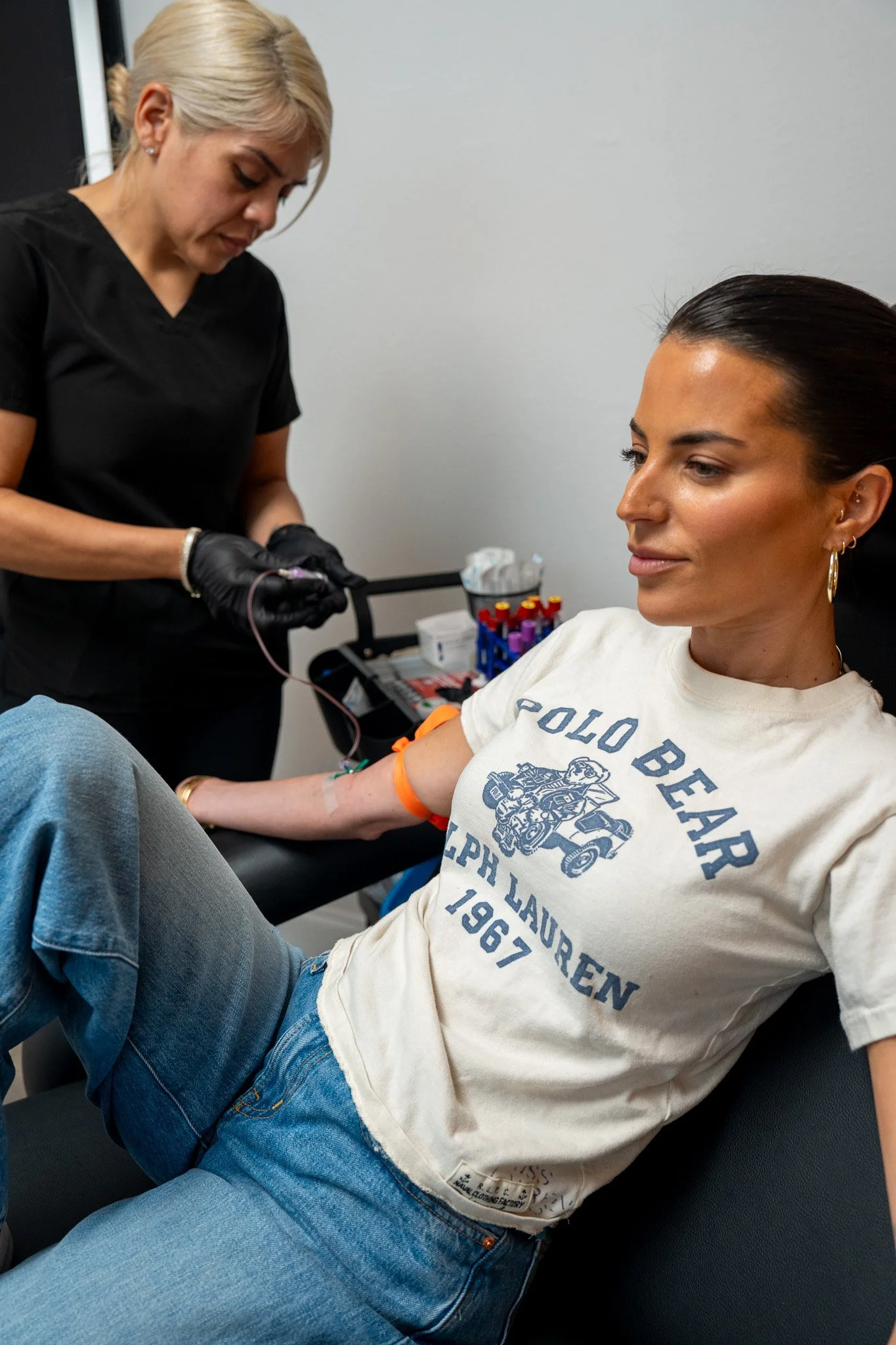 Functional medicine provider consulting with a patient and reviewing health history, lab results, and personalized wellness recommendations in a modern medical clinic.