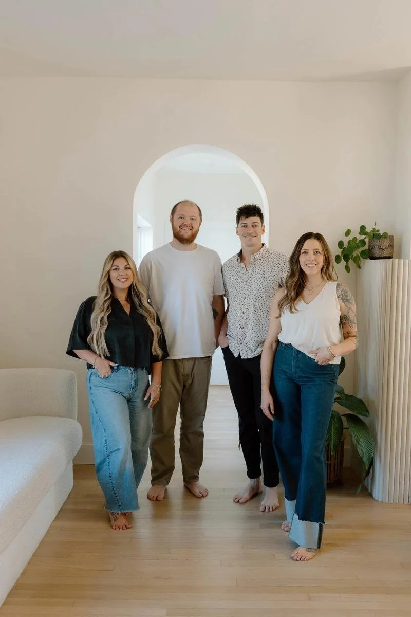 Four Free Spirit Chiropractic doctors standing together under archway in office — Free Spirit Chiropractic of Tulsa, Oklahoma
