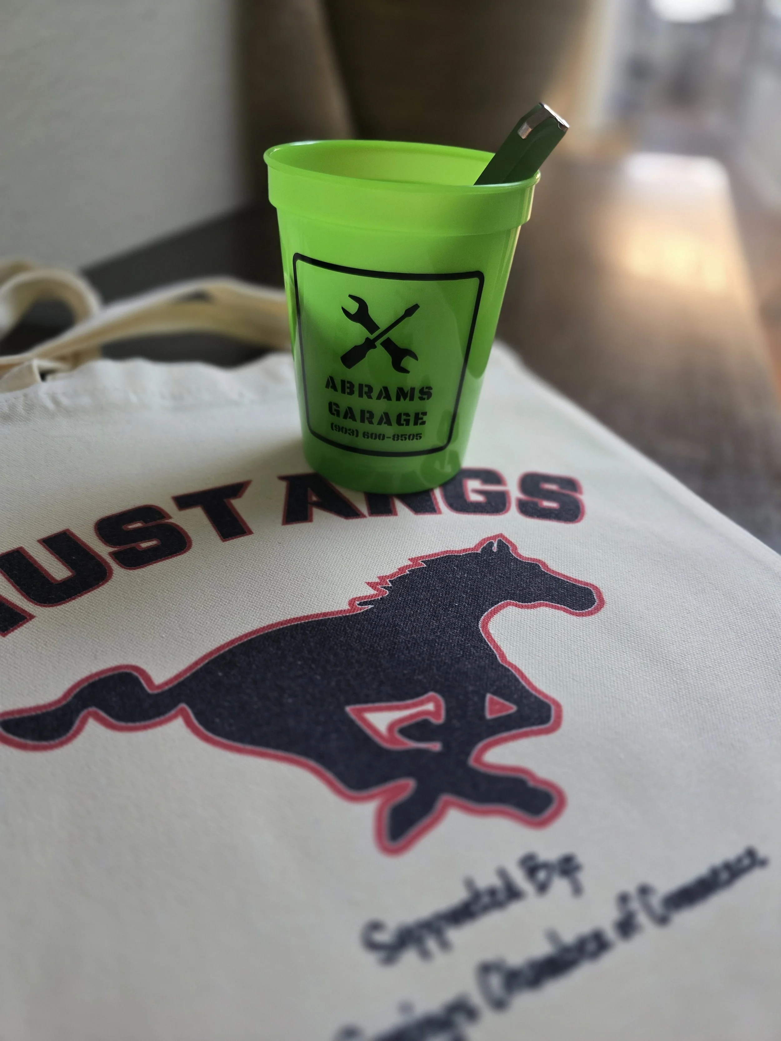 Abrams Garage - a great drinking glass, pen, and sticker! Abrams Garage is veteran run and is ready to serve you for you motorized vehicle needs; they can even get those generators ready for the changing Texas weather.