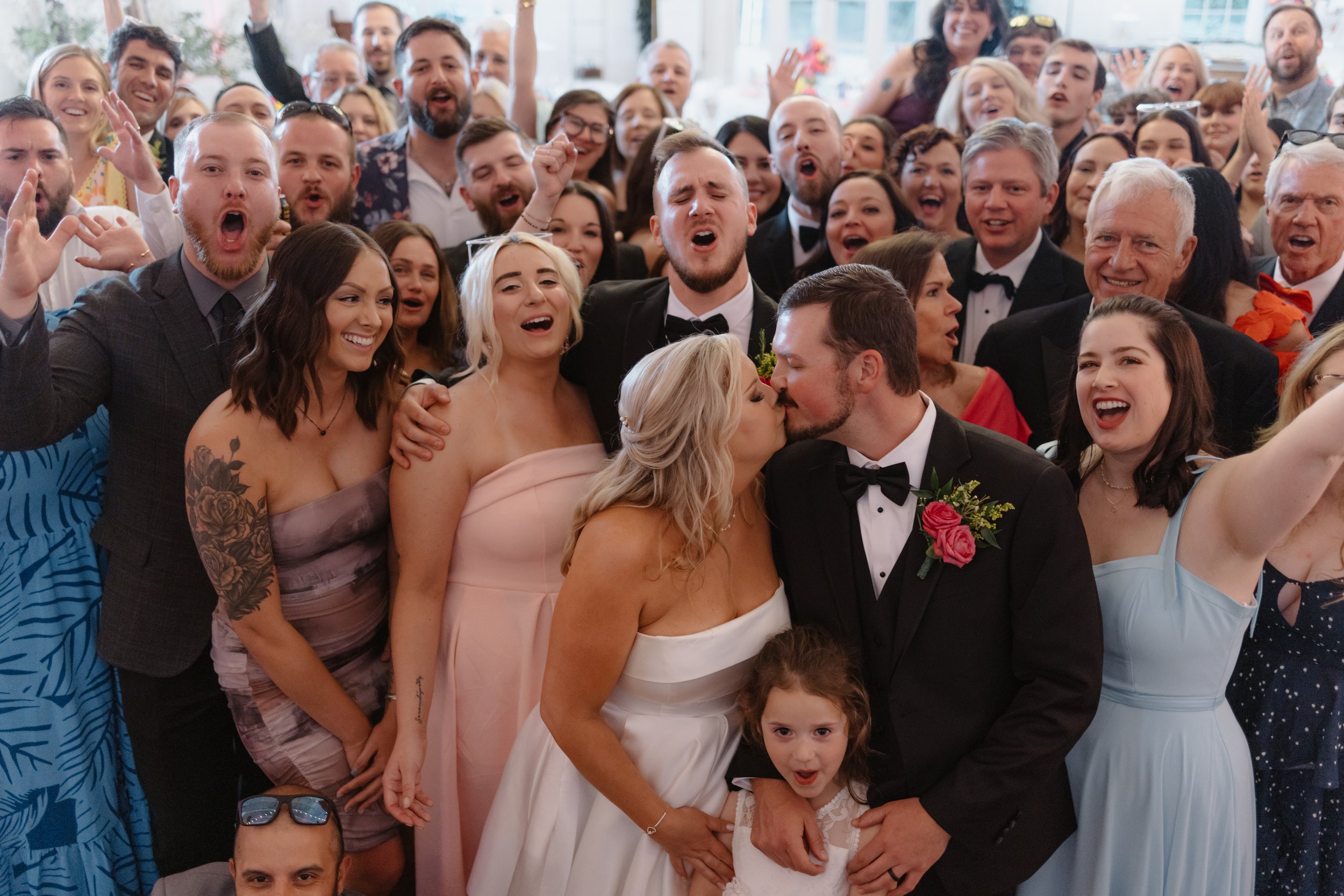 Nashville wedding couple take photos with their guests on the dance floor