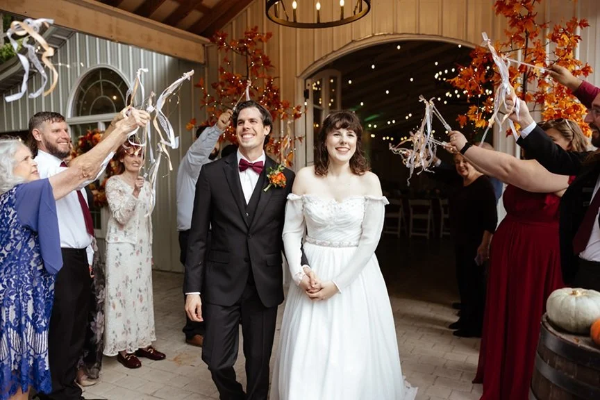 Couple happily leaving their micro wedding at a Nashville wedding venue that offered all inclusive planning for them. A simple, stress free wedding for a very affordable price.