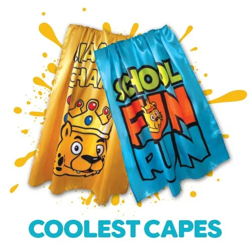 Two colorful capes, one yellow with a cartoon tiger wearing a crown and one blue with the words 'Coolest Capes' and a cartoon tiger, displayed against a splattered yellow paint background.