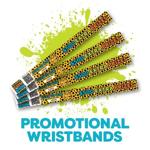 Five promotional wristbands for a contest with extra prizes, featuring bright yellow, black, and blue colors, arranged above the text 'PROMOTIONAL WRISTBANDS' with a green paint splatter background.