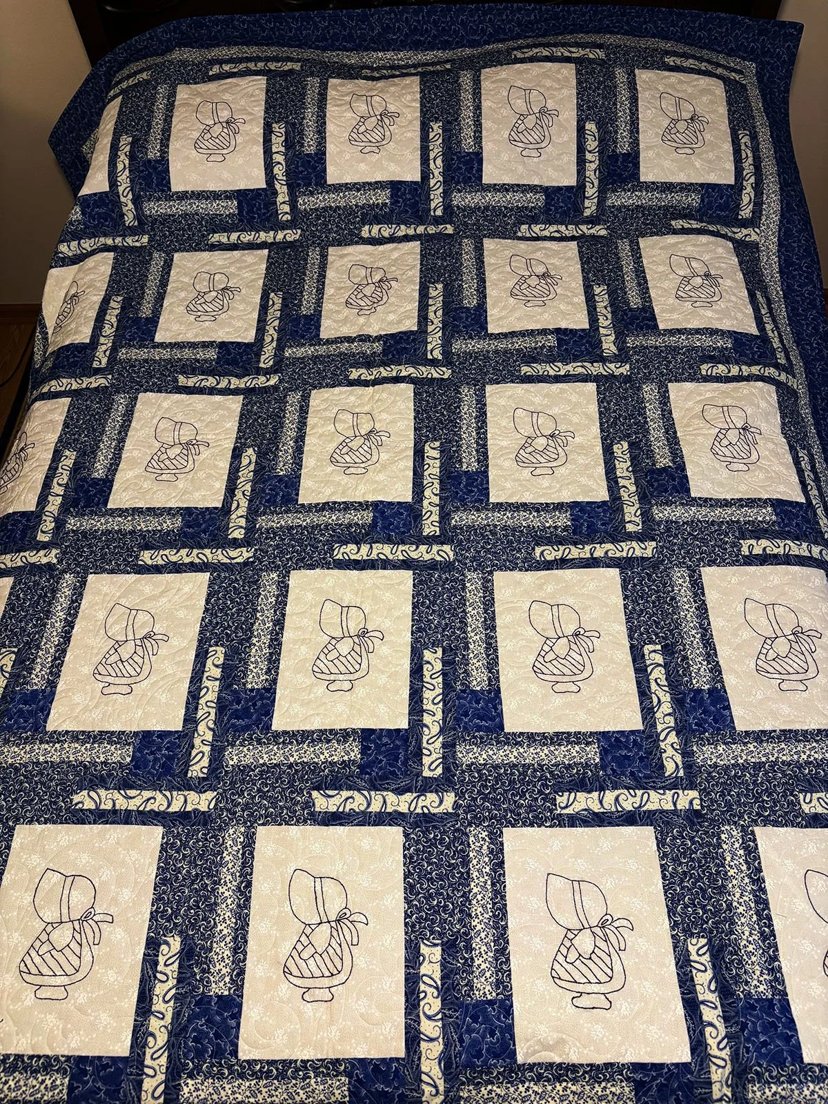 Sunbonnet Bluework, Quilt, Full, 70x82: Janet Lehman, Non-Affiliated Individual

A free pattern from the Quilter’s Collectibles 2006, this quilt is a grand reminder of days gone by when a sun bonnet was required attire for the harsh prairie sun.  Not