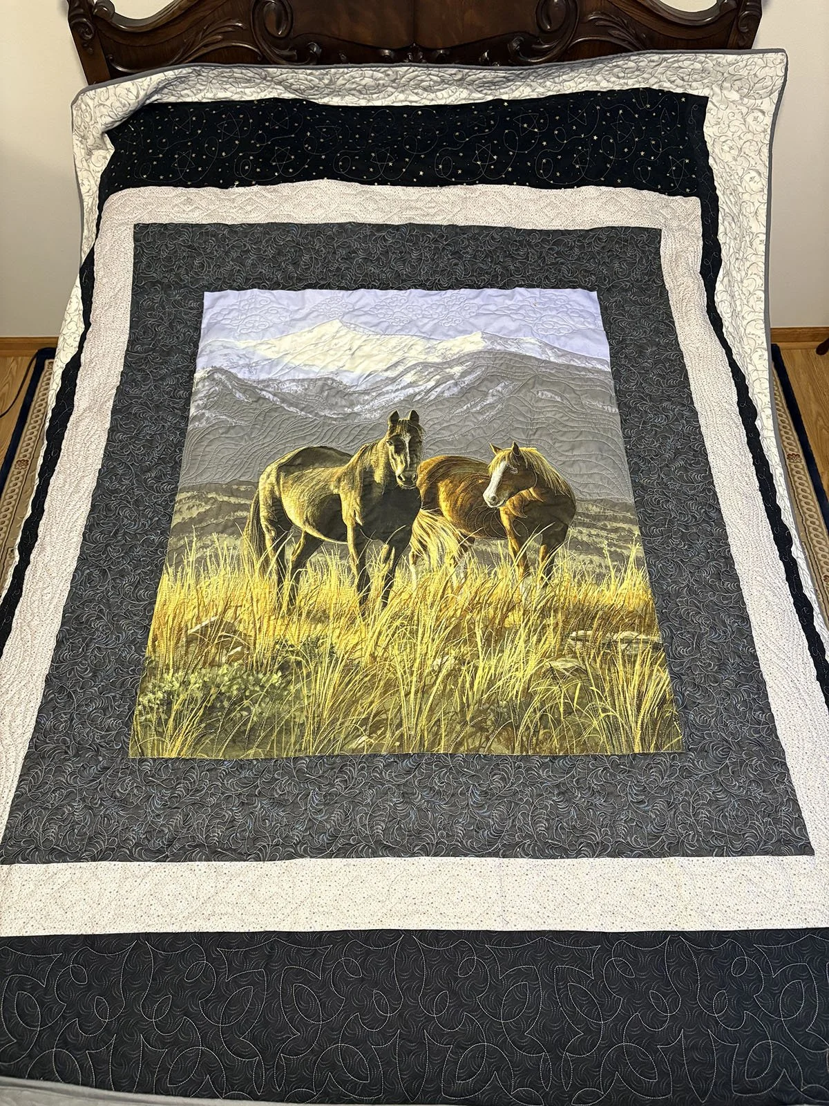 Horses in the Wild, Quilt, Full, 66x86: Phyllis Schrag, Non-Affiliated Individual

Made from a panel, this quilt is intended for the horse lover.  The custom quilting includes starts, wood grain, western motif, wrenches, looping ropes, and clouds.  T