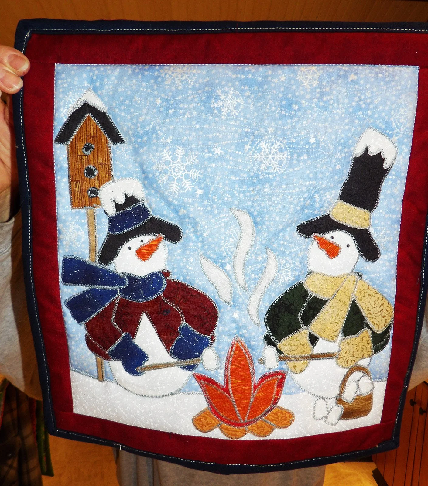 Snowman Campfire, Other, 13x14: Lindy Siebert, Bethesda Mennonite Church

Red and blue snowman campfire wall hanging.