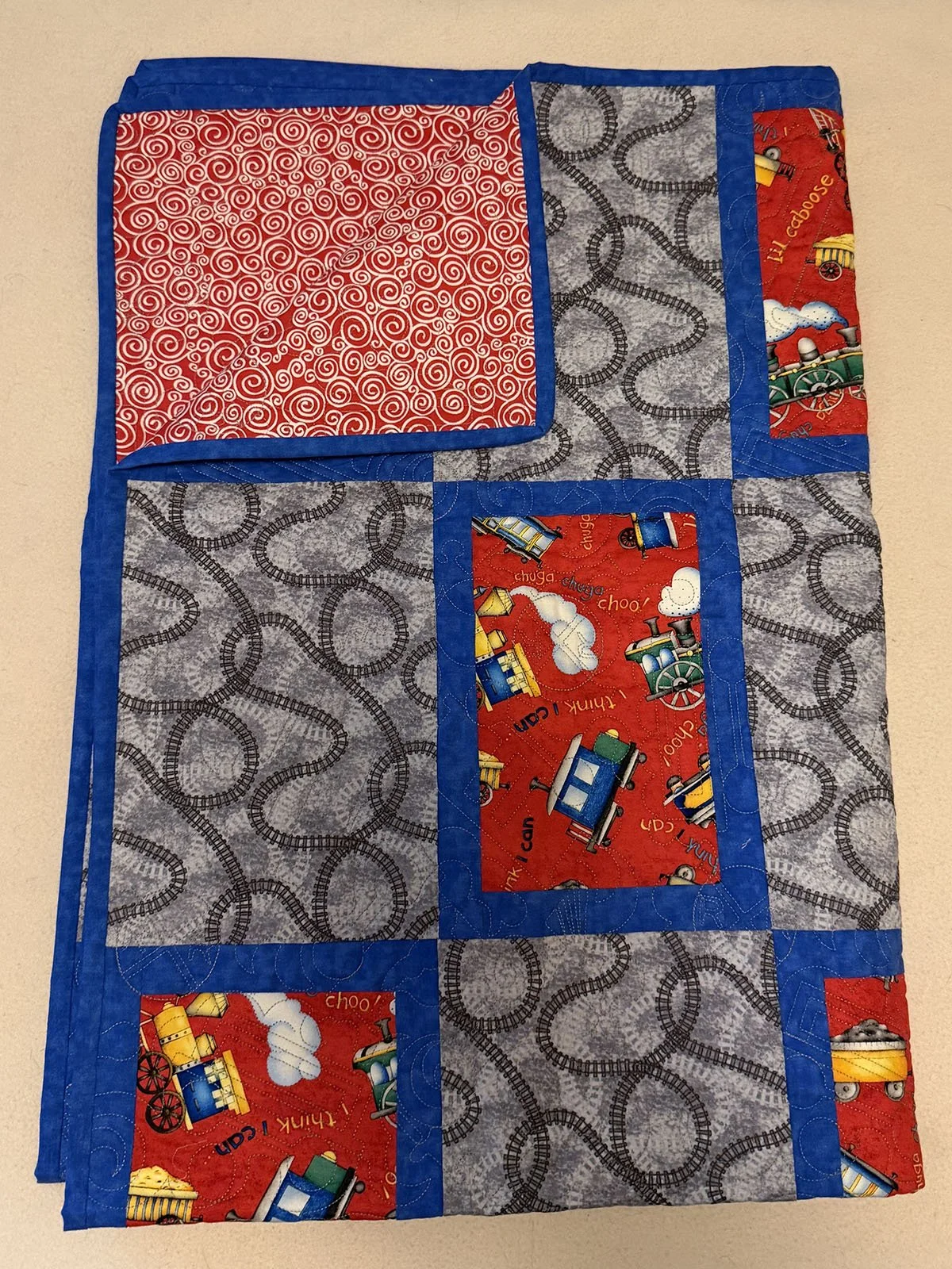 Making Tracks, Quilt, Baby, 37x53: Kathy Boshart, First Mennonite, Lincoln

This quilt was started by my dear friend and ‘bonus mom’ Phyllis, who made many quilts before dementia took away her gift. Though she can no longer sew, her legacy continues 