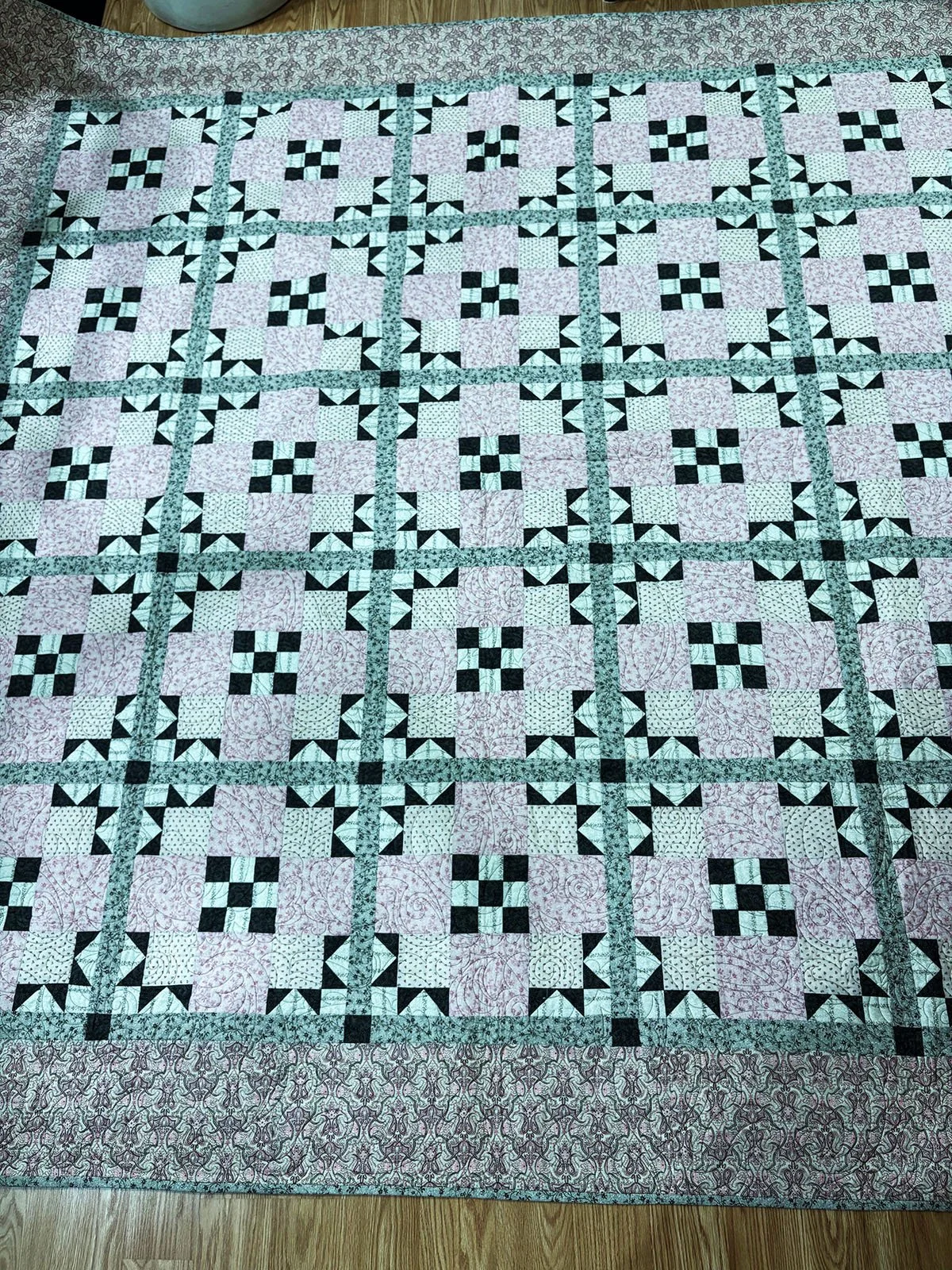 Star Crossed, Quilt, Full, 86x87: Janet Lehman, Non-Affiliated Individual

A combination of traditional patchwork using two 9-patch blocks, one inside the other, with bear claw corners creates an amazingly unique design reminiscent of early cathedral