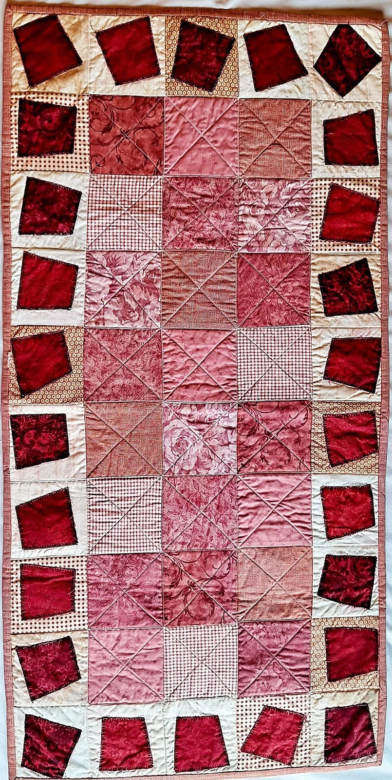Roses Are Pink, Table Runner, 20x49: Rhonda Brubacher, First Mennonite Lincoln

Pieced and machine quilted by Diana Tappe from McCook, NE.