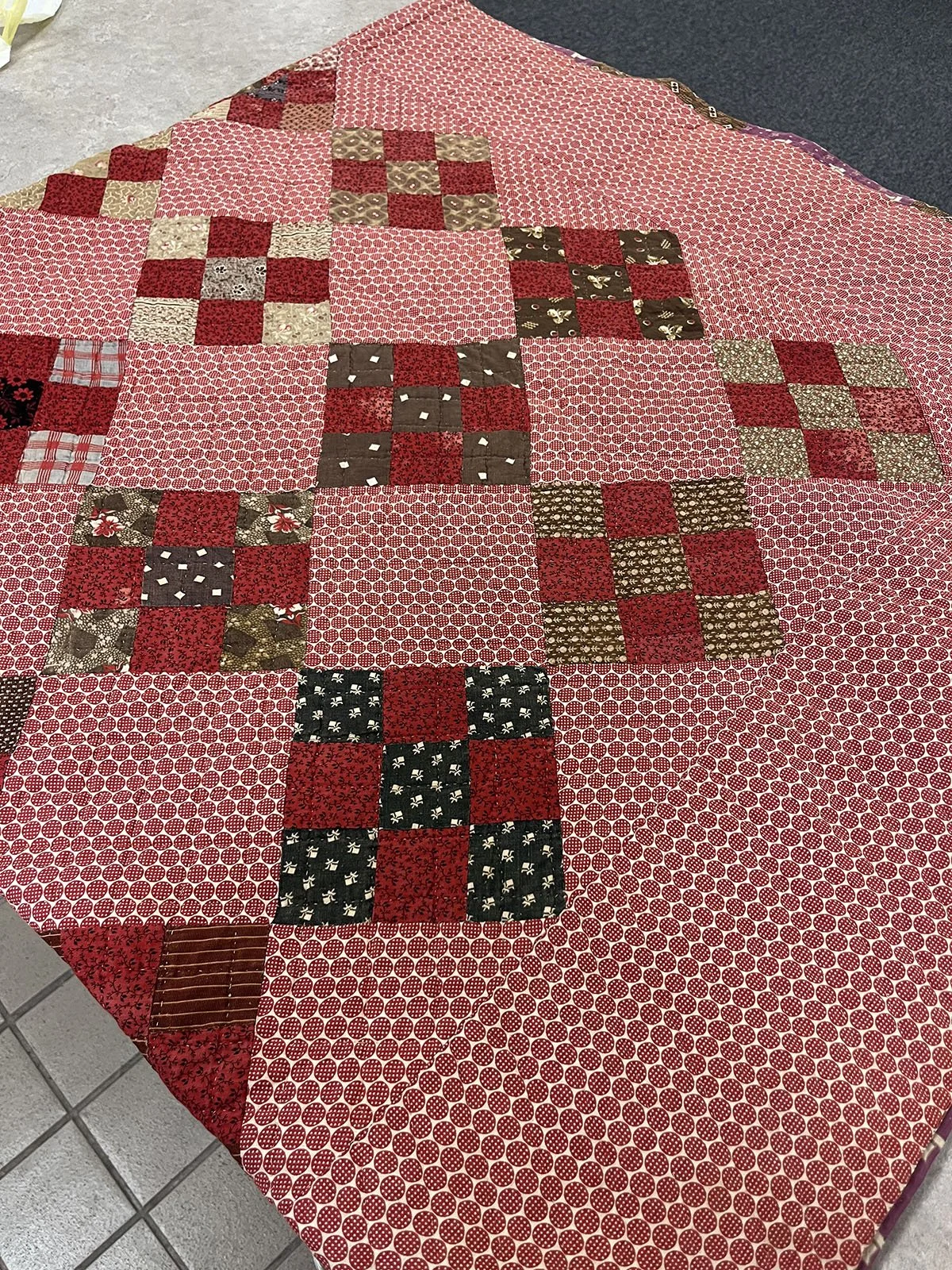 19th Century 9 -Patch, Quilt, Full, 76x77: Kristin Wiebe, Non-Affiliated Individual

This is a vintage 19th century nine patch antique quilt. The colors are predominantly turkey red with various chocolate, off-white, and black prints, the backing has