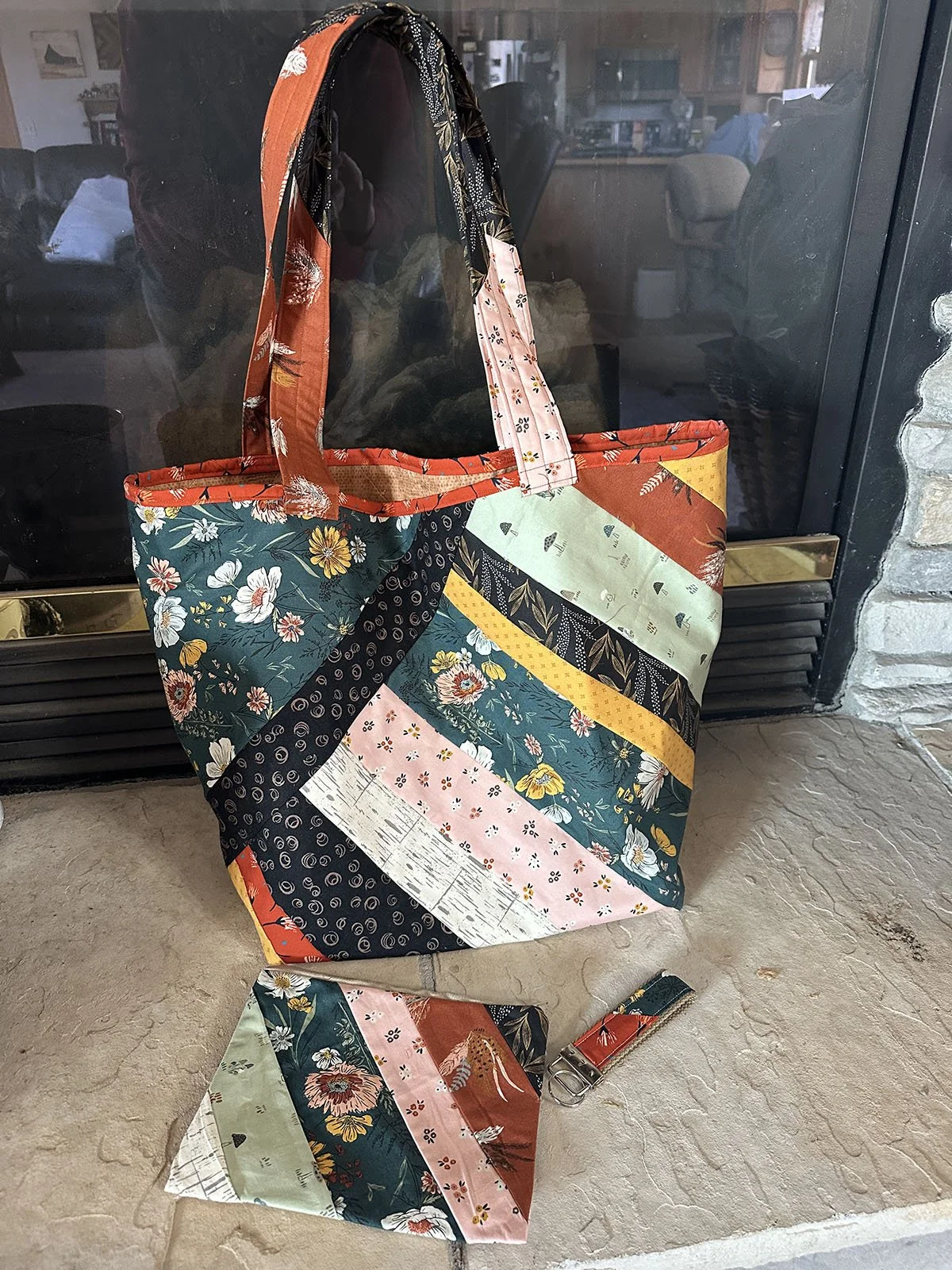 Patchwork Bag Set, Other, 13x15: Larry & Terri Lamb, First Mennonite Church, Beatrice

Strip pieced bag, zippered bag, and key fob. Great for groceries, crafts, books, etc. Bag was made with a June Taylor quilt as you go batting. Bag is 13" W x 15" H