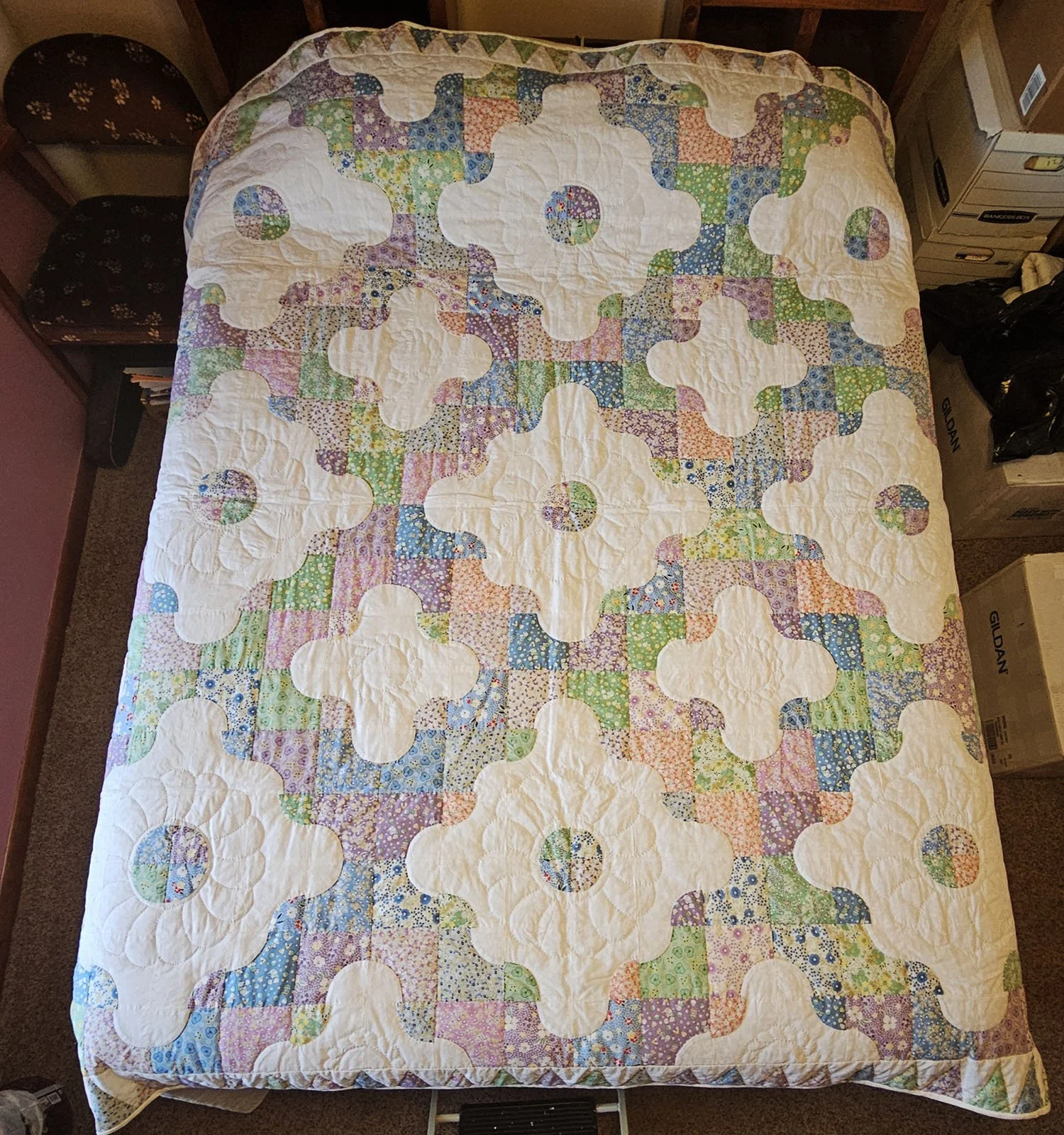 Puzzle Time, Full Quilt - 84x84: Material Resources Center of Ephrata, Pa.

Pastel colored puzzle pieces of 30's reproduction fabrics surround  fields of white in this whimsical quilt.  The border features triangles of the same fabrics alternating wi