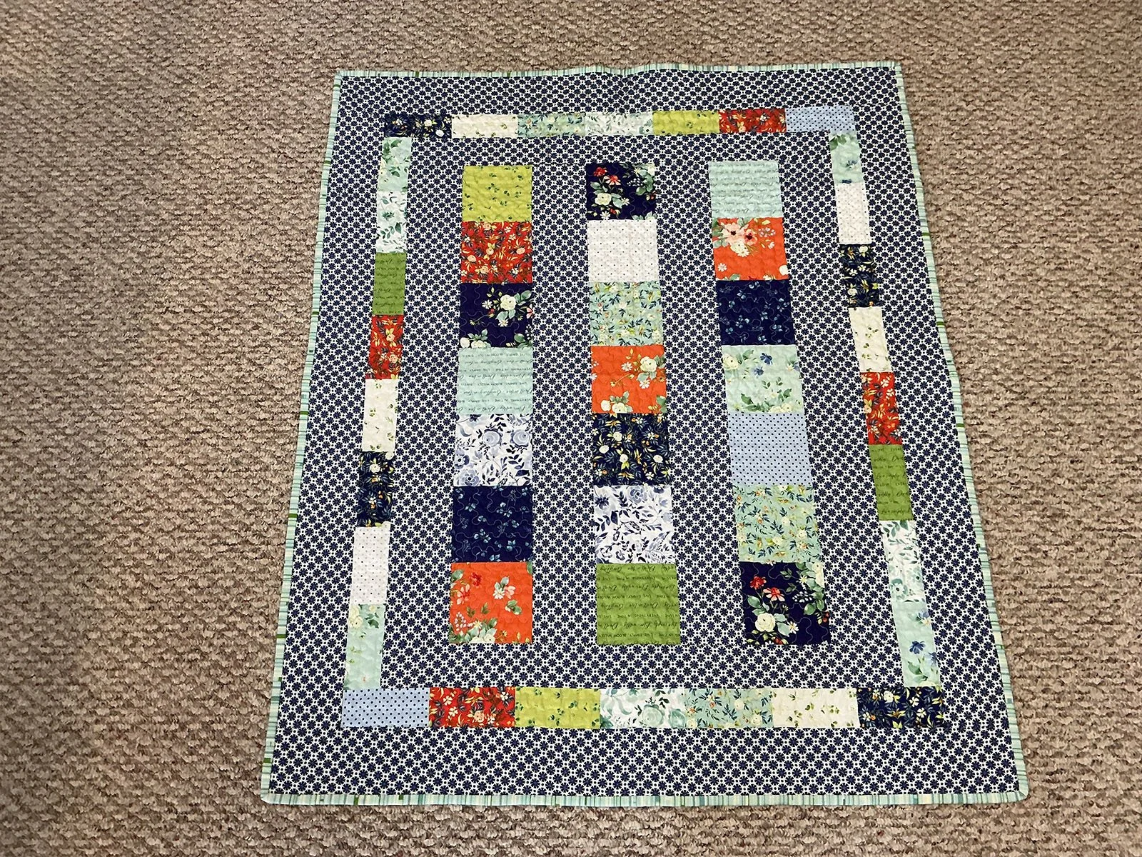 Spring Has Sprung, Quilt, Lap/Throw, 36.5x44: Karen Alderfer, Non-Affiliated Individual

Multicolored cheerful “Line Dance” pattern.
Machine pieced and machine quilted using Hobbs Heirloom 80/20, cotton/poly batting.
