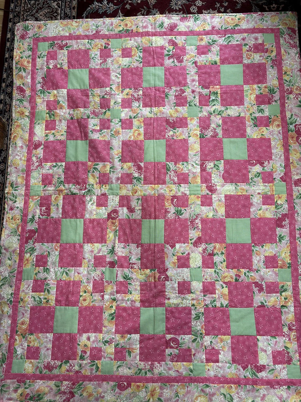 Homeward Bound, Quilt, Lap/Throw, 50x63: Janet Lehman, Non-Affiliated Individual

The focus fabric of flowers is accented by green gingham and pink stars in the blocks and the border. A very cheerful quilt, perfect for a baby or a homebound adult. Cr
