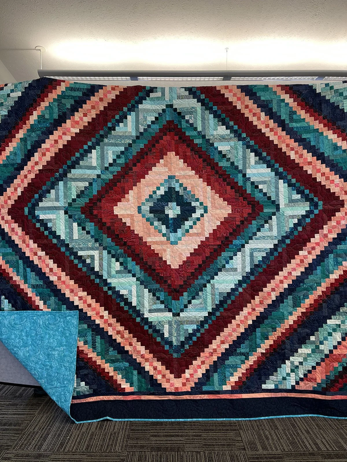 Trip Around the World Quilt, King, 101x101: Salem Mennonite Women, Salem Mennonite, Shickley

Jewel tone colors make up this beautiful quilt. The top was donated to MCC and purchased at the Kansas Relief Sale. Machine quilted by Brenda Mesloh using d