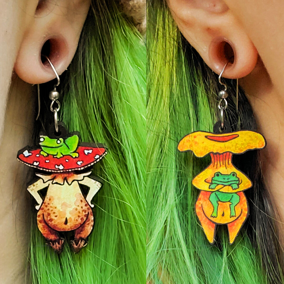 Which set is your favorite - The standing ones or the sitting ones?? Both earring sets feature TWO different Funguise characters and are made with stainless-steel findings so if you have metal allergies like me, they won't freak out your skin.​​​​​​​