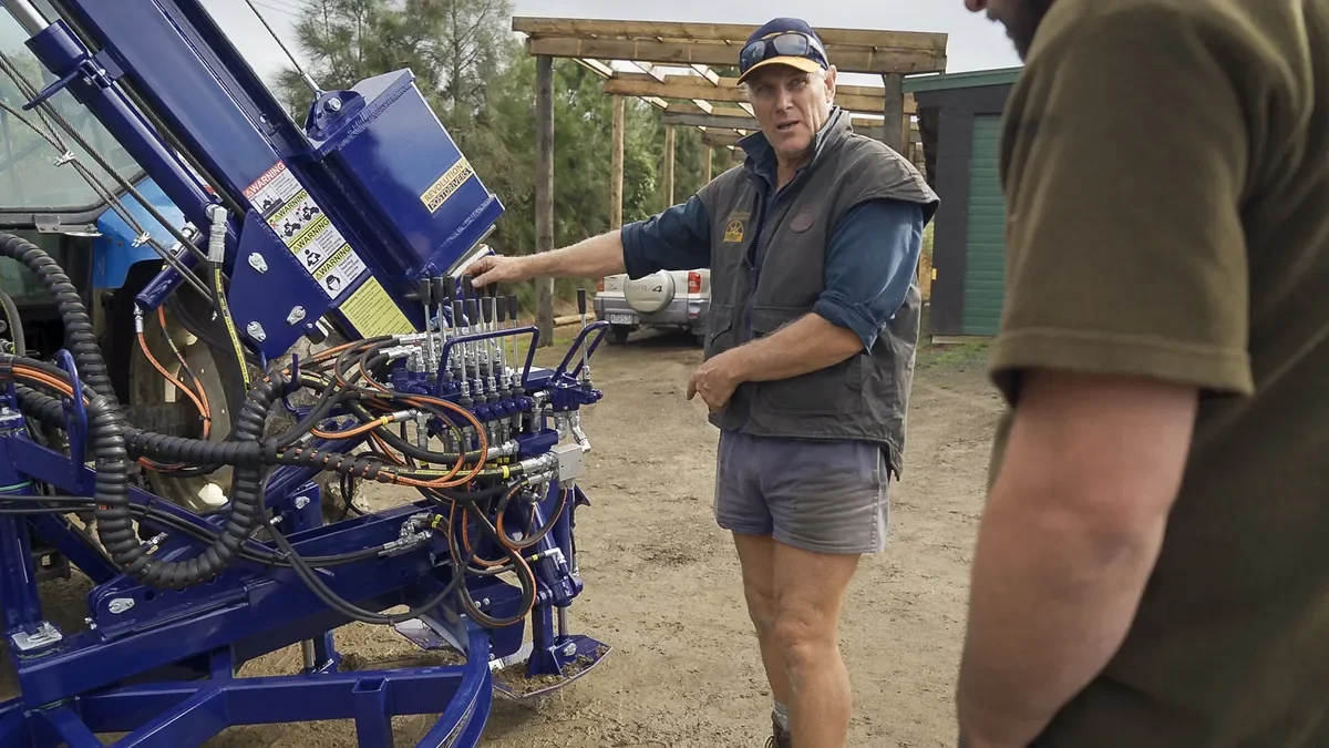 Tony a fencing contractor and owner demonstration of the hydraulic valve controls on a Revolution 180 post driver