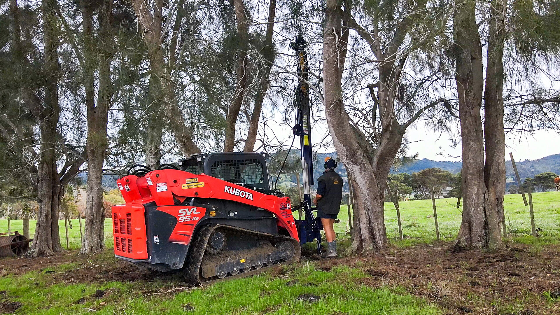 rear mount post driver in trees