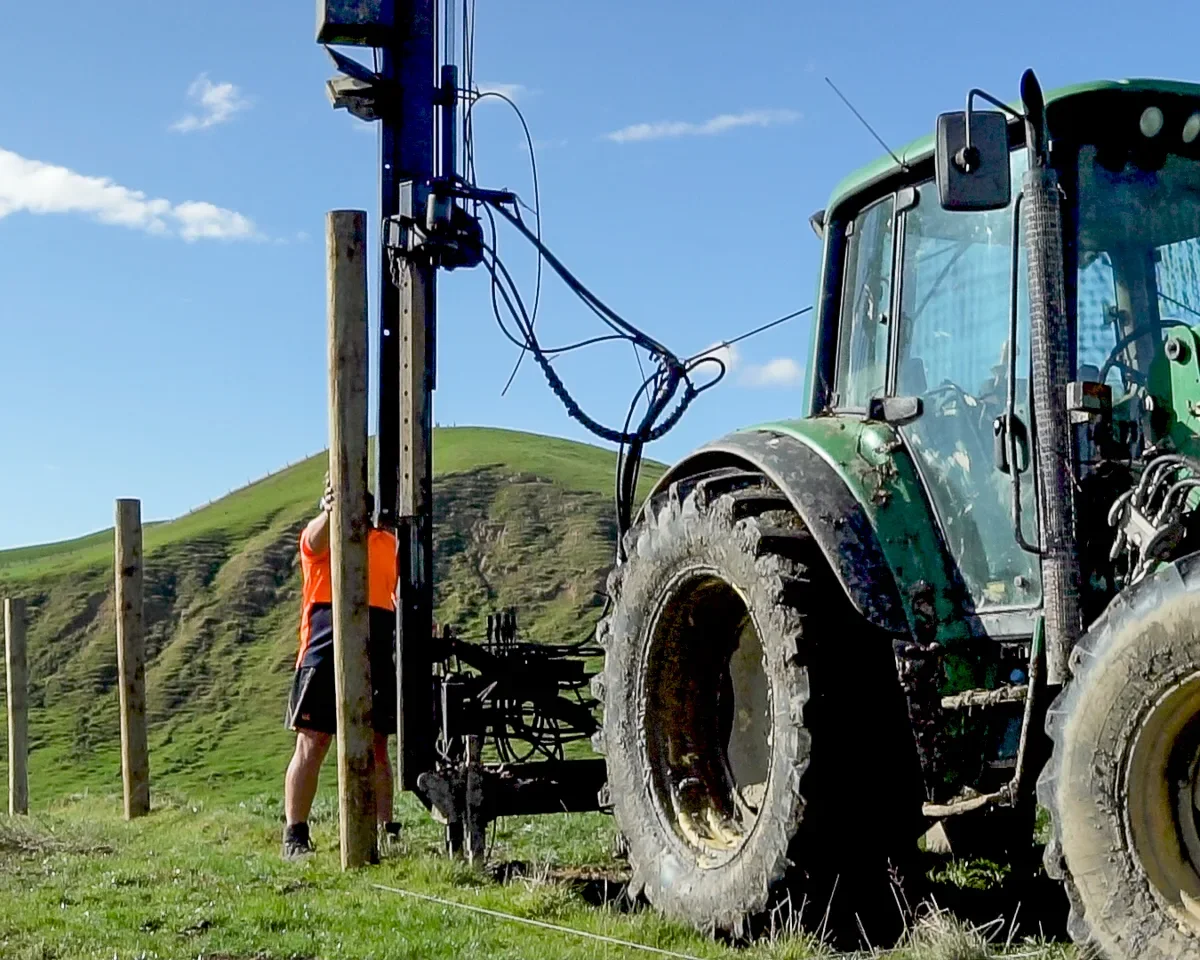 28-revolution-ss-john-deere-fencing-green-hills-blue-sky-compressed.webp