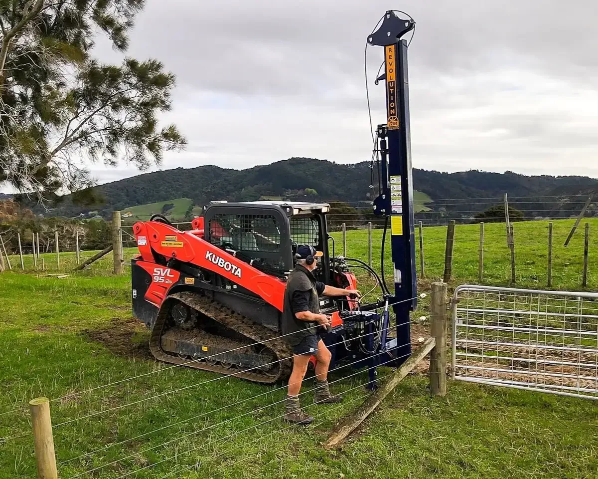 14-revolution-rm-kubota-operator-adjusting-controls-mountains-square-compressed.webp