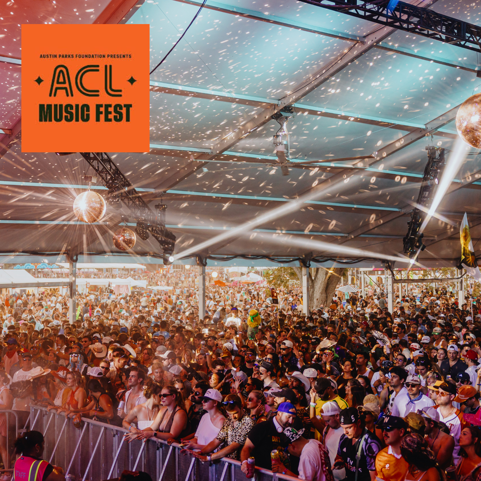 Large crowd enjoying a LP Giobbi with SoCo Women's Chorus concert under a tent at ACL Music Fest, with disco balls and colorful lights.