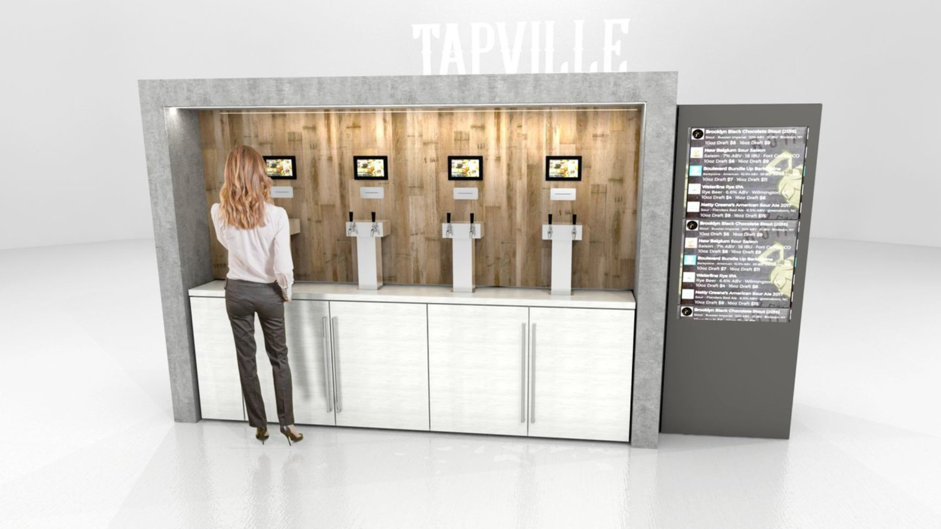 A woman with long red hair looking at a craft beer self-serve station with four digital screens and taps, set against a wooden wall with a gray backdrop and a digital menu board on the side.