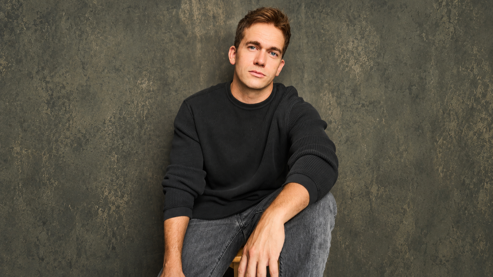 Centered Portrait Against Olive Studio Backdrop.png