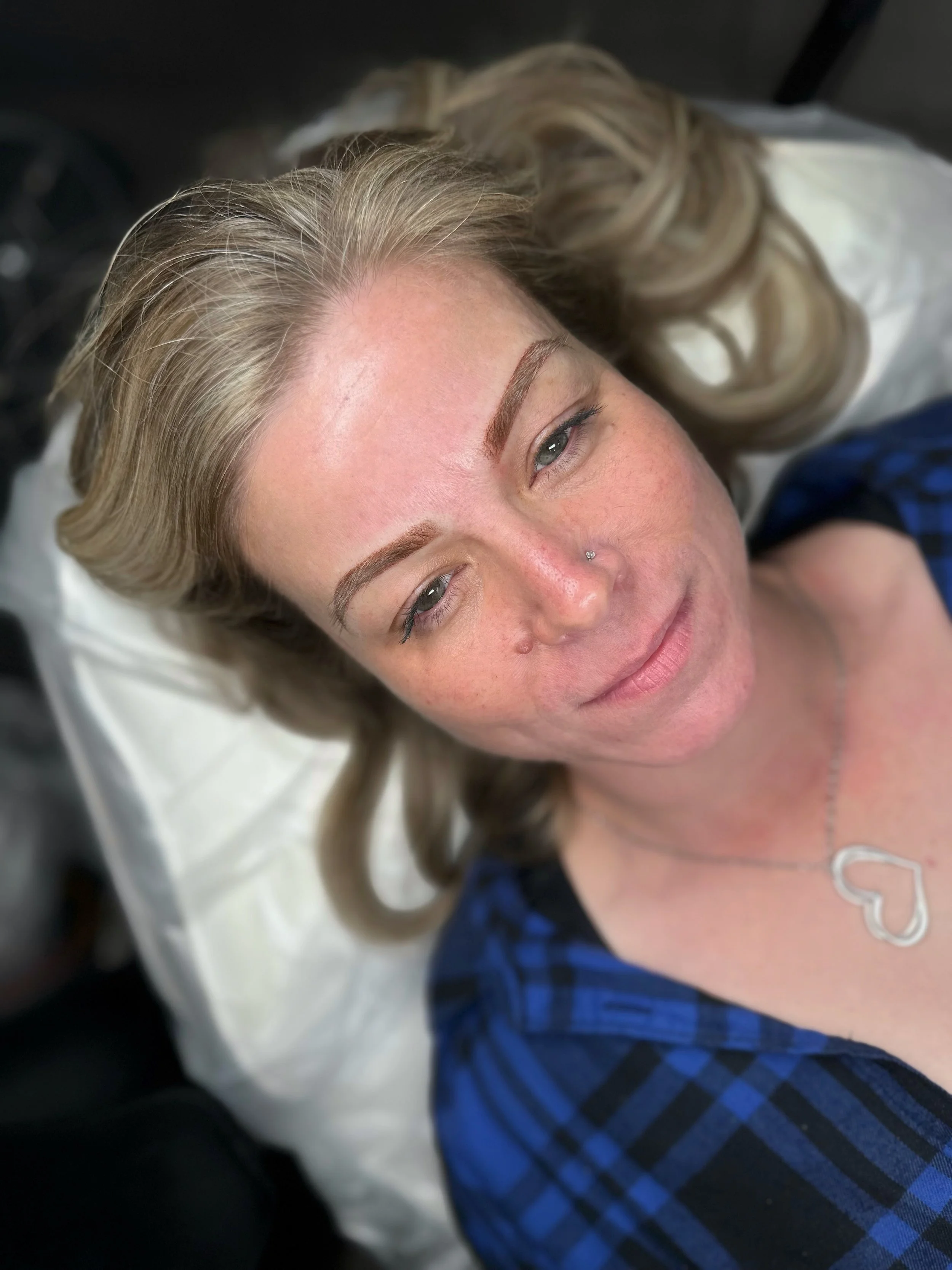 Lip blush tattoo in soft pink tone on light skin