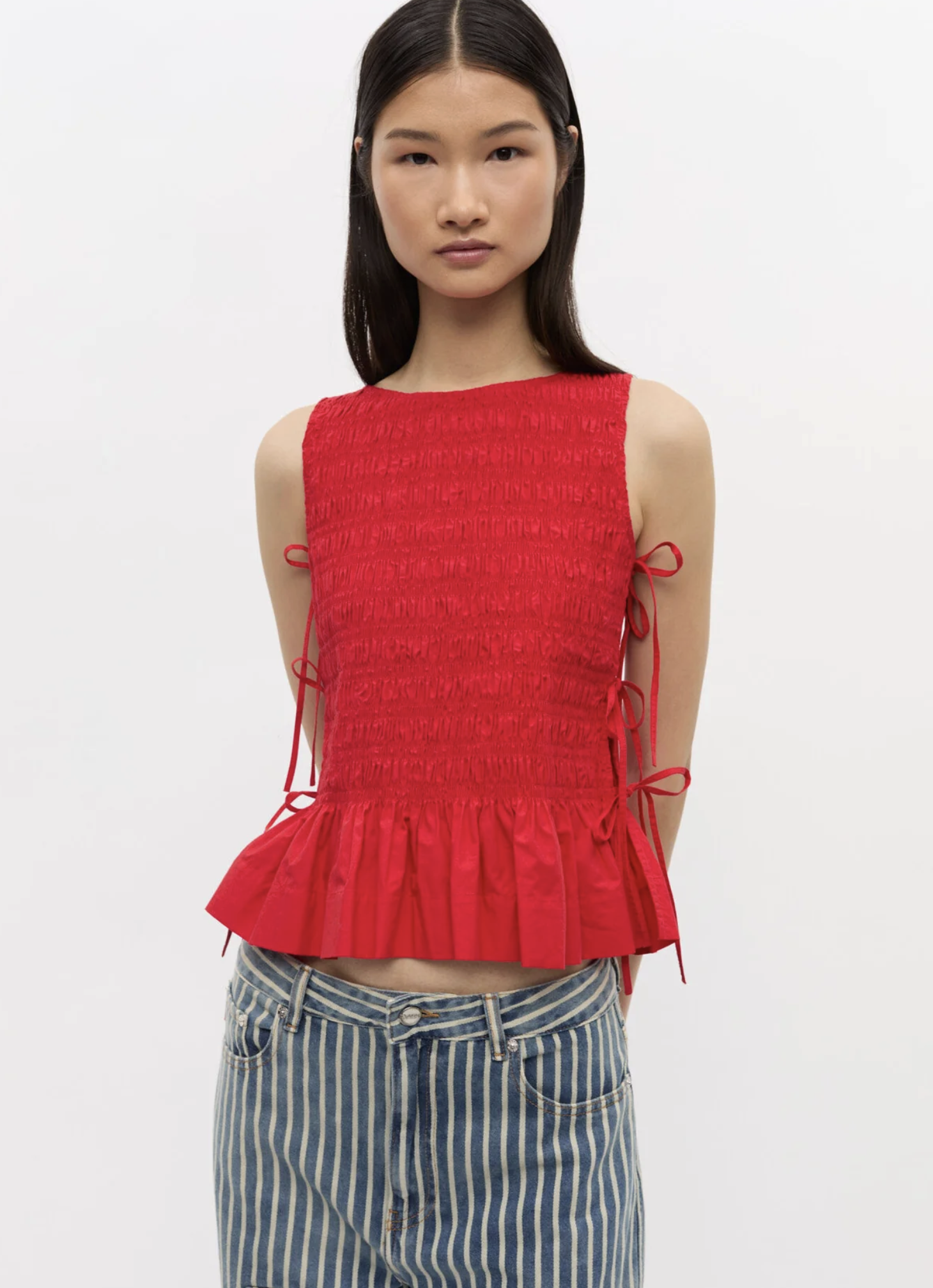 Woman in red ganni tank top